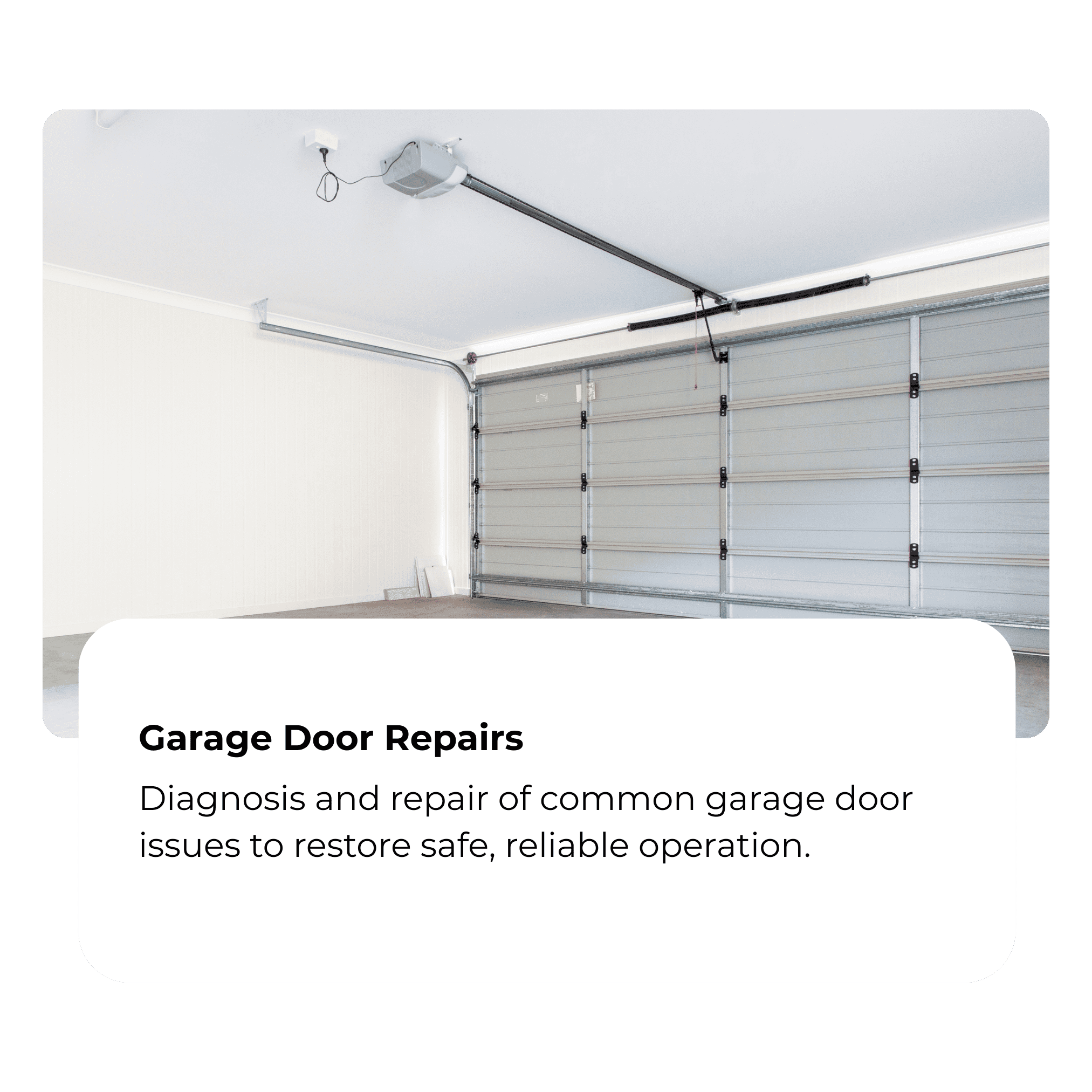 Empty garage with a closed metal garage door, and a white wall on the side. The garage has a garage door opener installed on the ceiling.