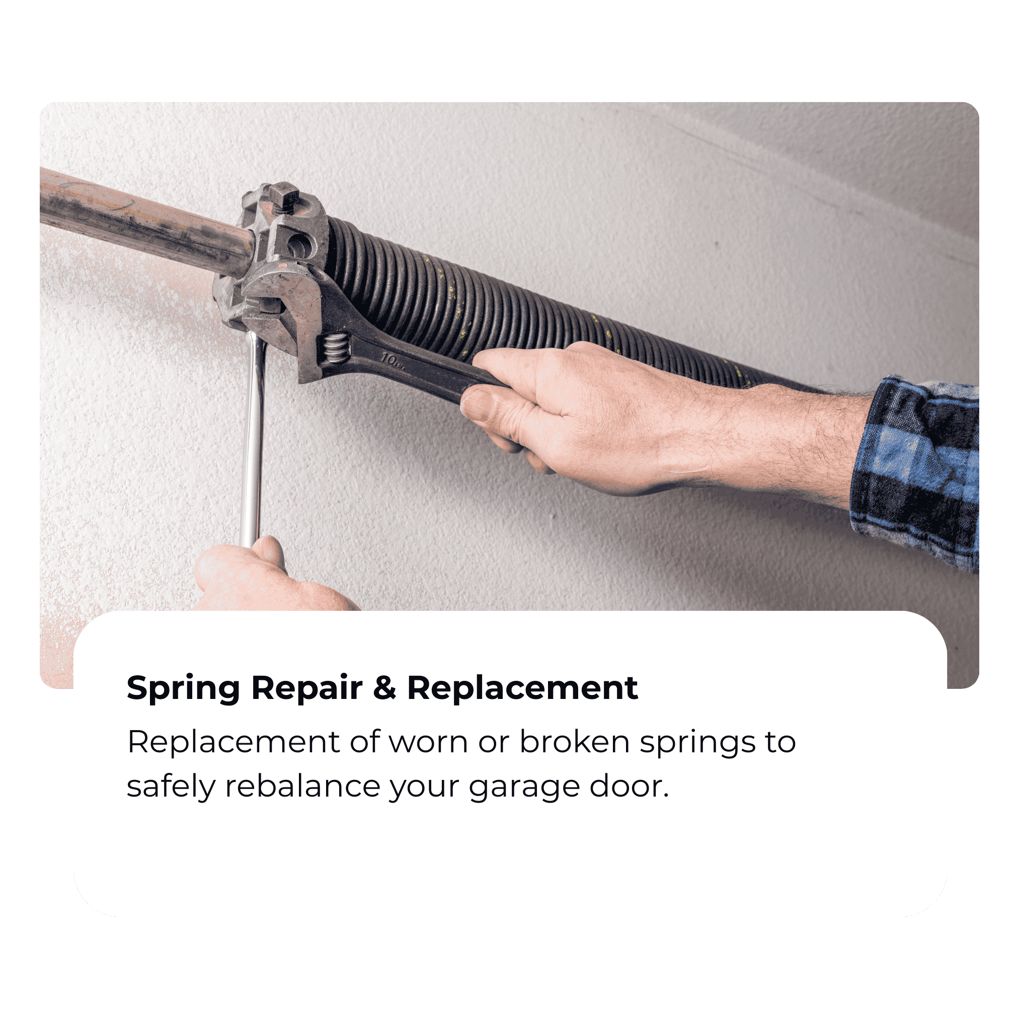 Person replacing garage door spring with a wrench on a wall.