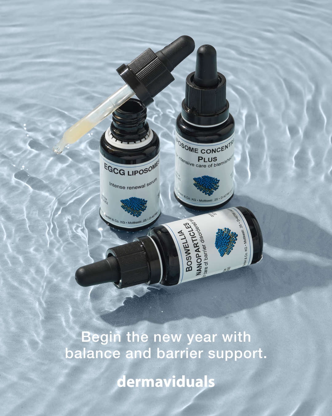Three bottles of skincare products with droppers and a bottle lying on a reflective surface, with a message that reads, "Begin the new year with balance and barrier support. dermaviduals."