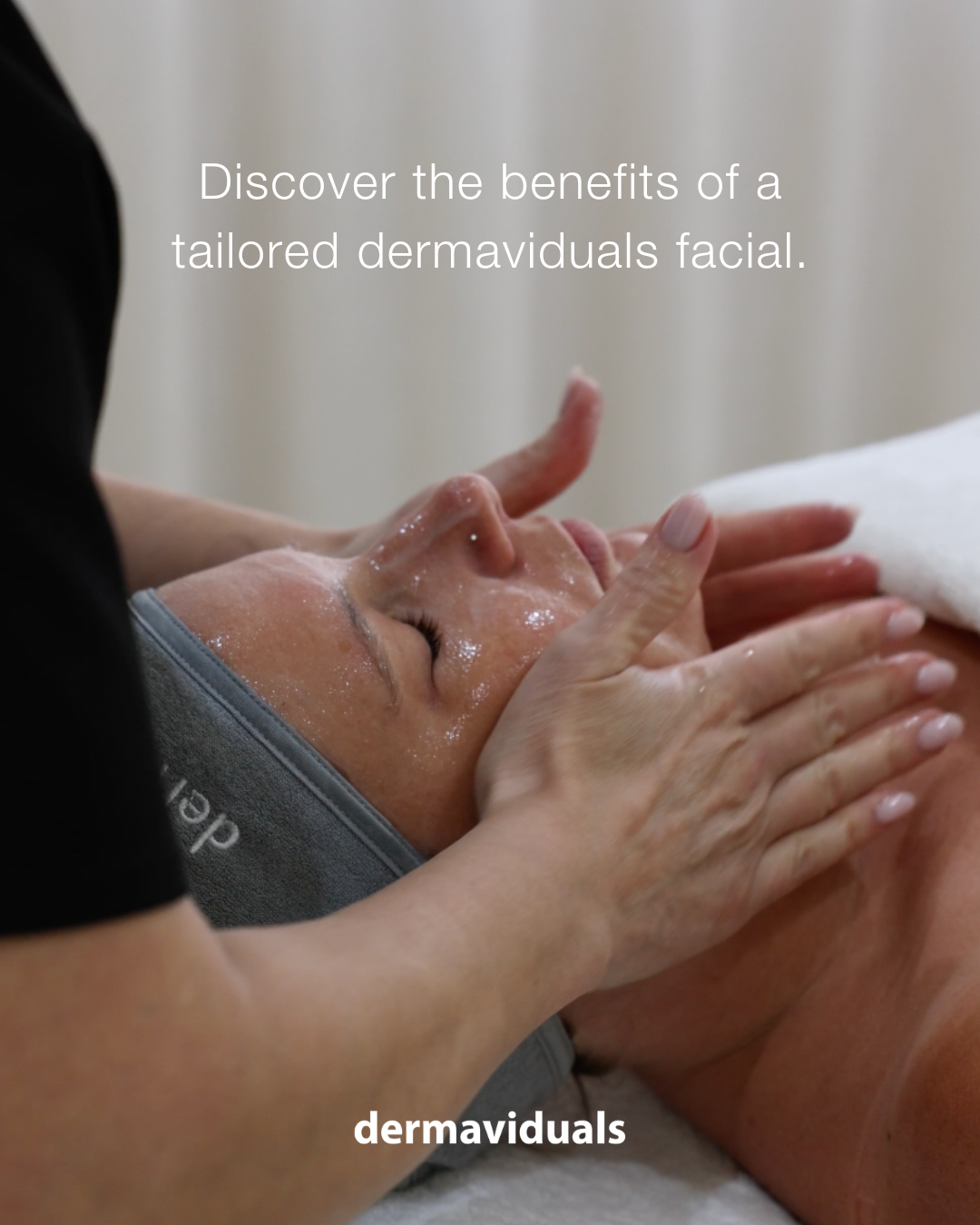 A person receiving a facial treatment with a skincare product applied on their face by a professional in a spa or clinic setting.