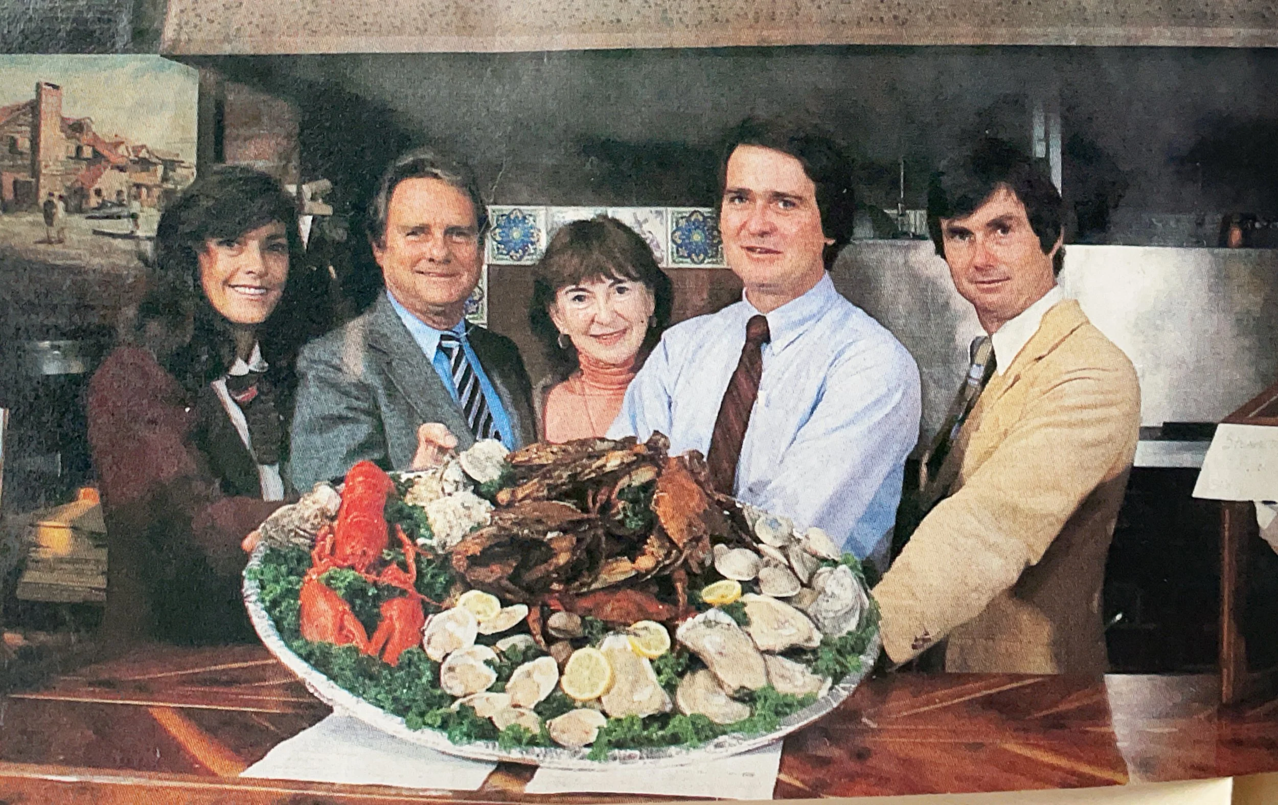  Newspaper photograph of Olivia Harrison Phillips, Brice Phillips, Shirley Phillips, Steve Phillips and Jeff Phillips, the family that owned and ran the crab house. 