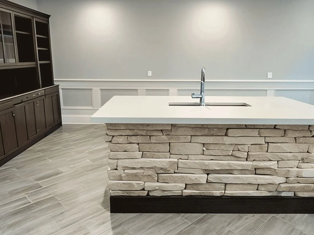 Modern-Kitchen-With-Textured-Stone-Island-And-Neutral-Decor.jpg