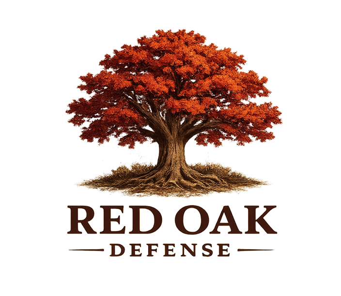 A large tree with red-orange leaves stands behind the text 'RED OAK DEFENSE' in stylized letters.