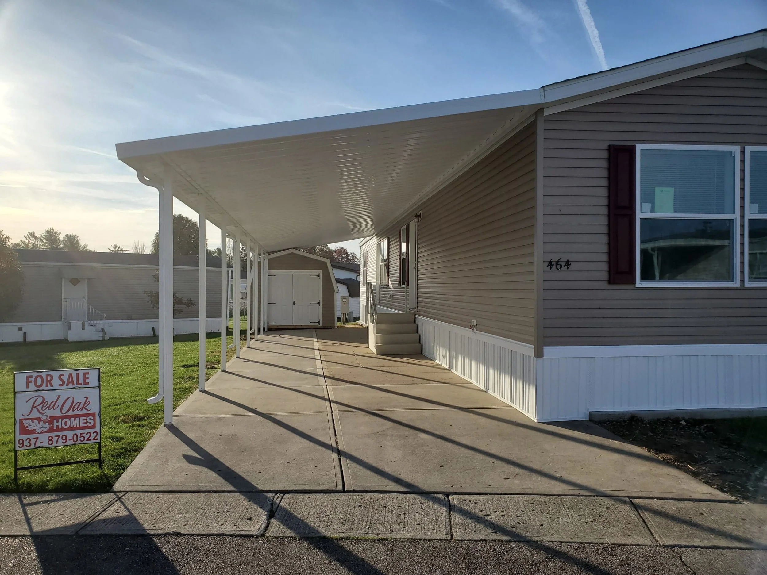 Manufactured home with covered carport at Red Oak community
