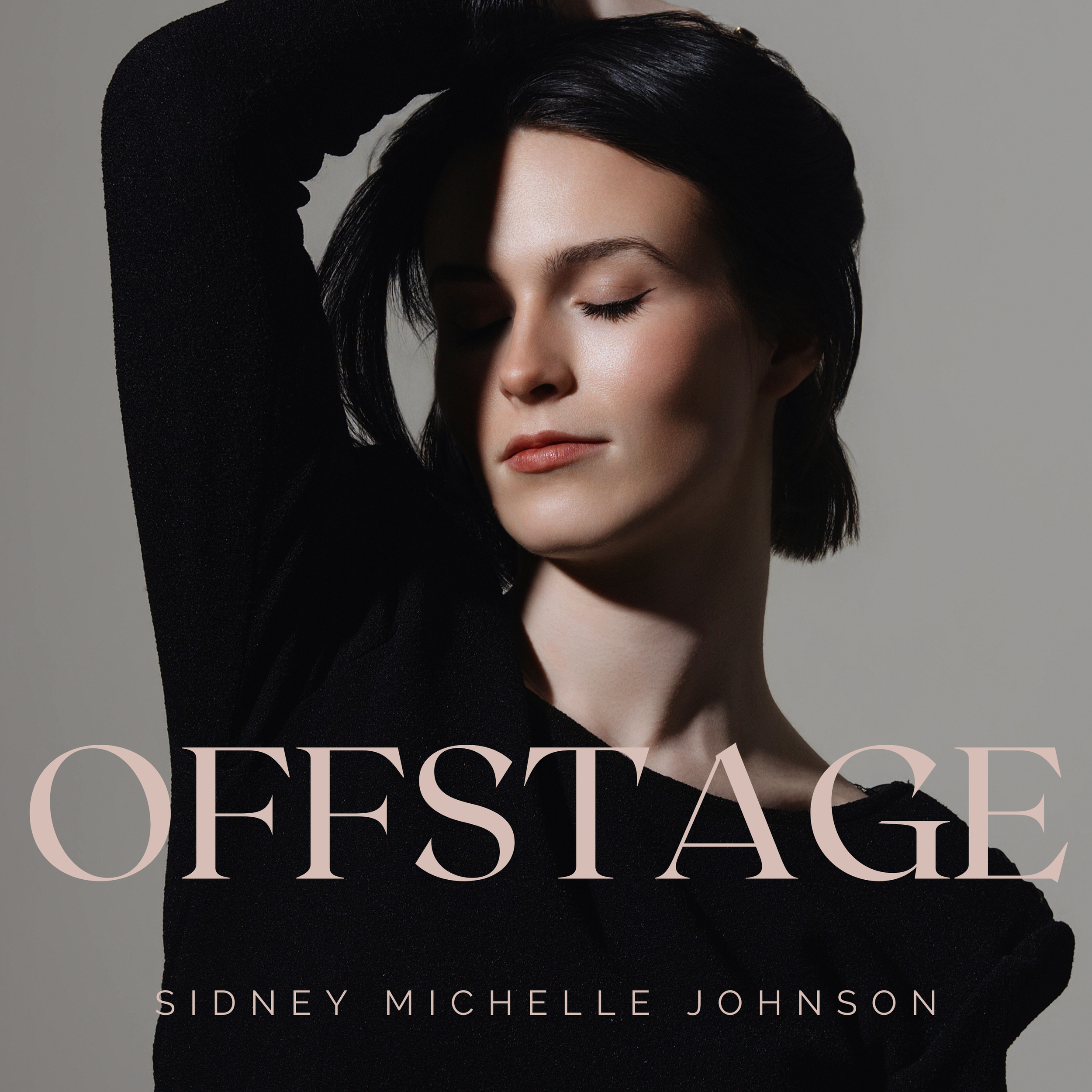 Close-up of a woman with dark hair, closed eyes, and natural makeup, wearing a black top, with the book title 'CONFIDENCE' and author SidNey Michelle Johnson partially visible.