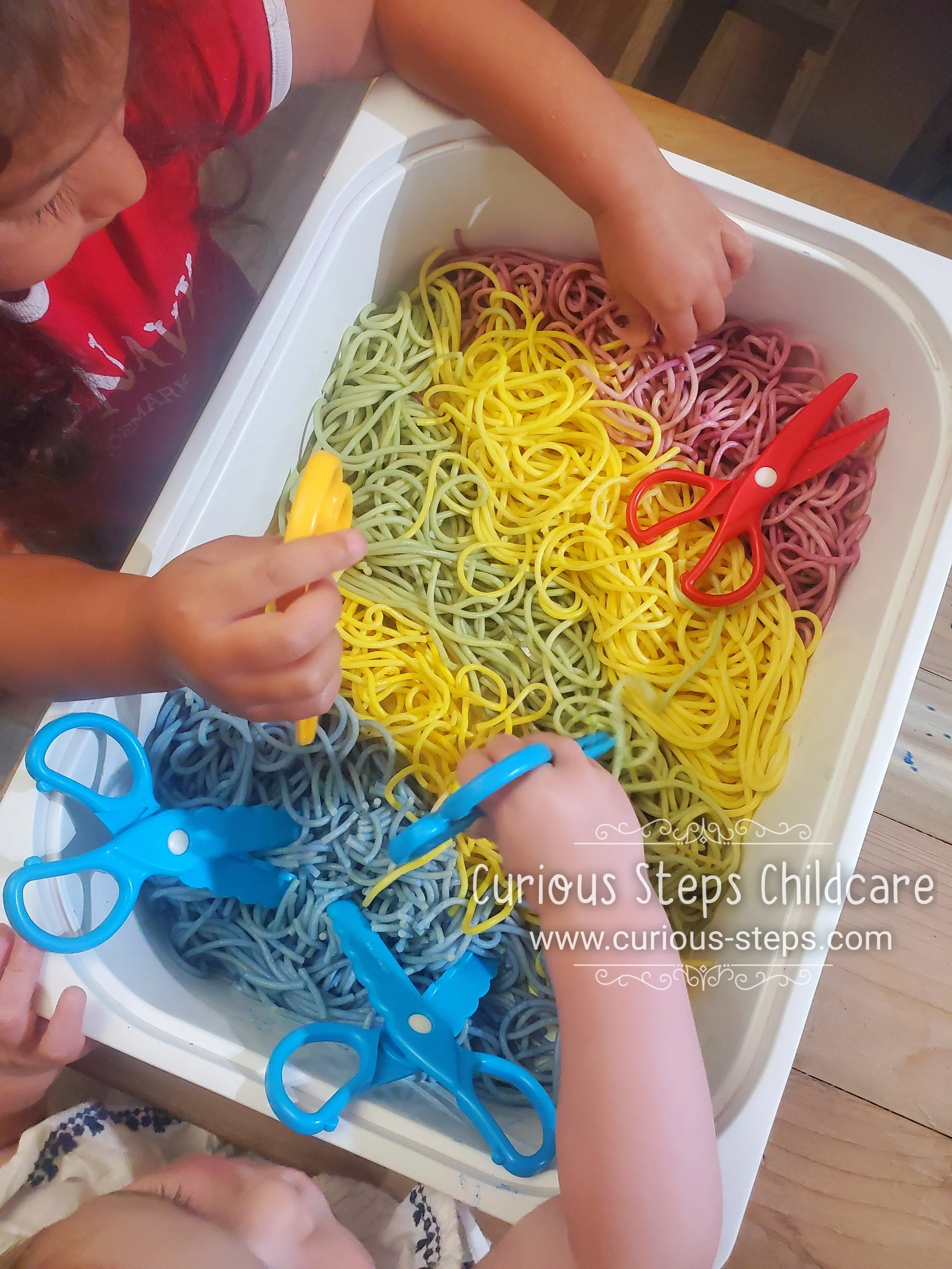 colored-spaghetti-noodles-cutting-preschool.jpg