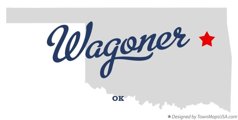 Map of Oklahoma with the word 'Wagoner' in large navy blue cursive across it, a red star in the northeast, and 'OK' near the bottom.