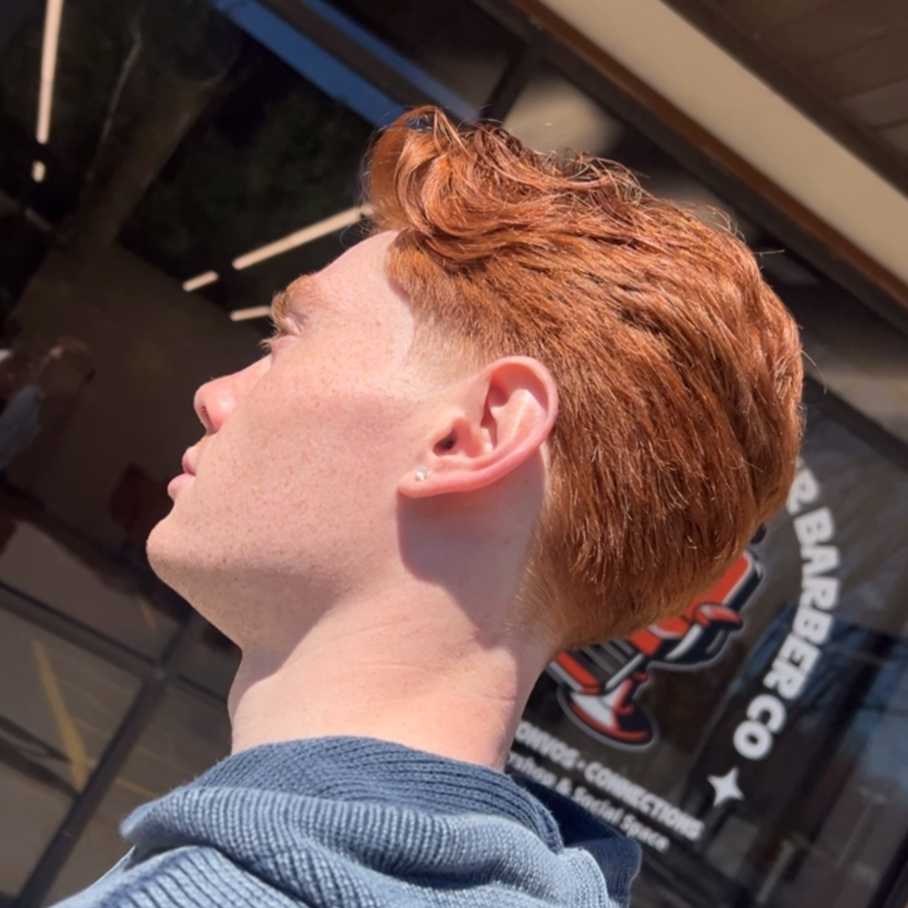 Mens Brush/Slick back haircut with graduated layers and a low taper on the sides and back