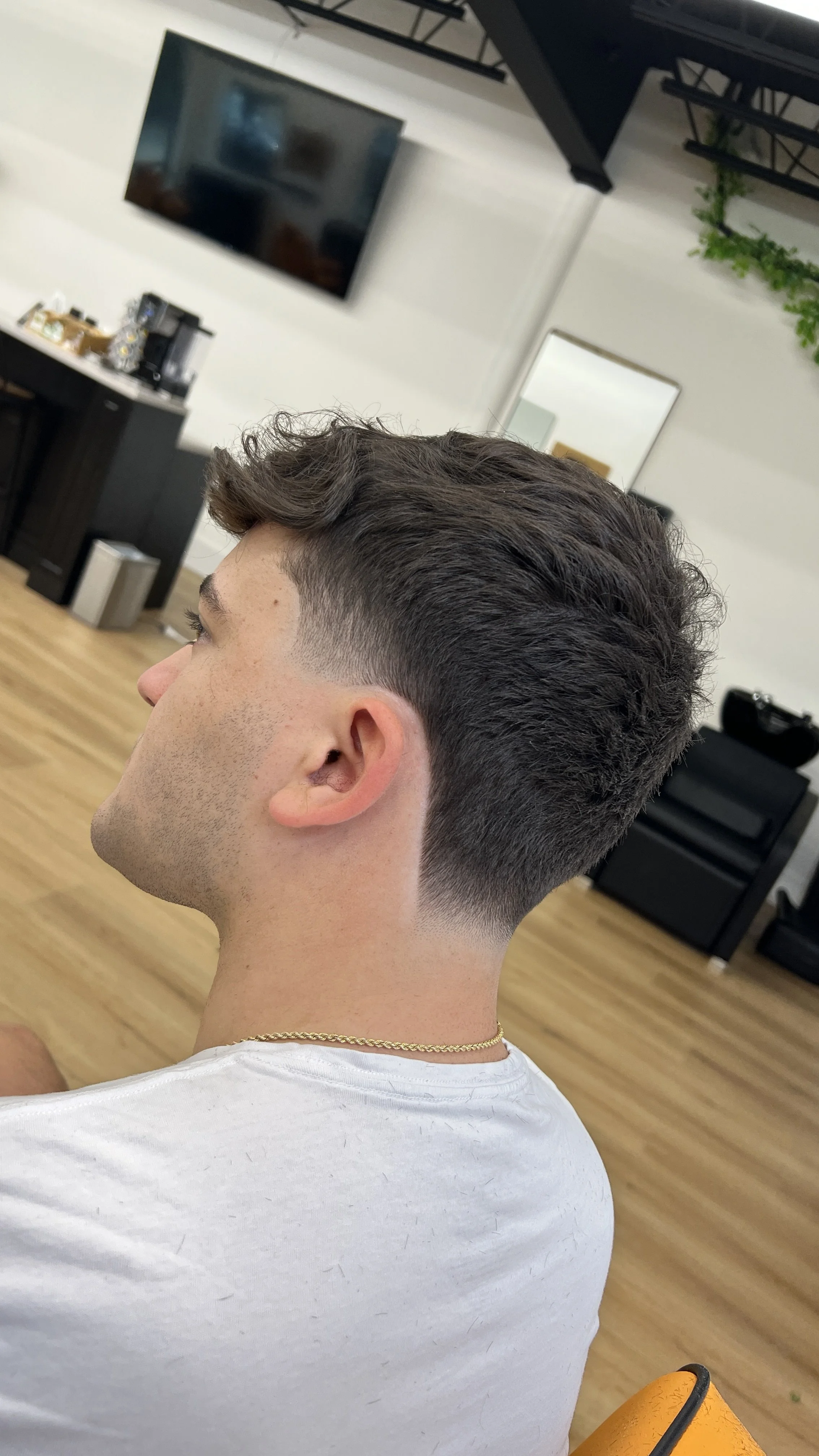 Mens haircut , low taper fade with texture on top