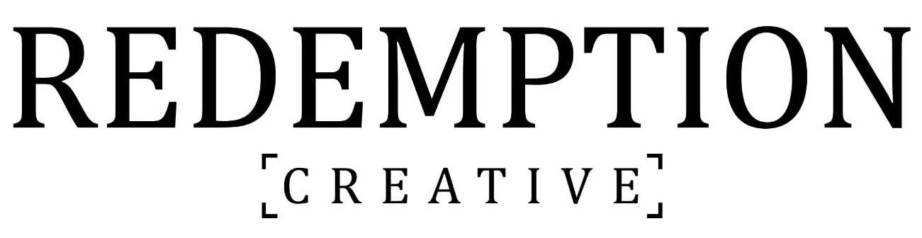 The image shows the words "REDEMPTION CREATIVE" with "REDEMPTION" in large black letters and "CREATIVE" in smaller black letters inside a bracket.