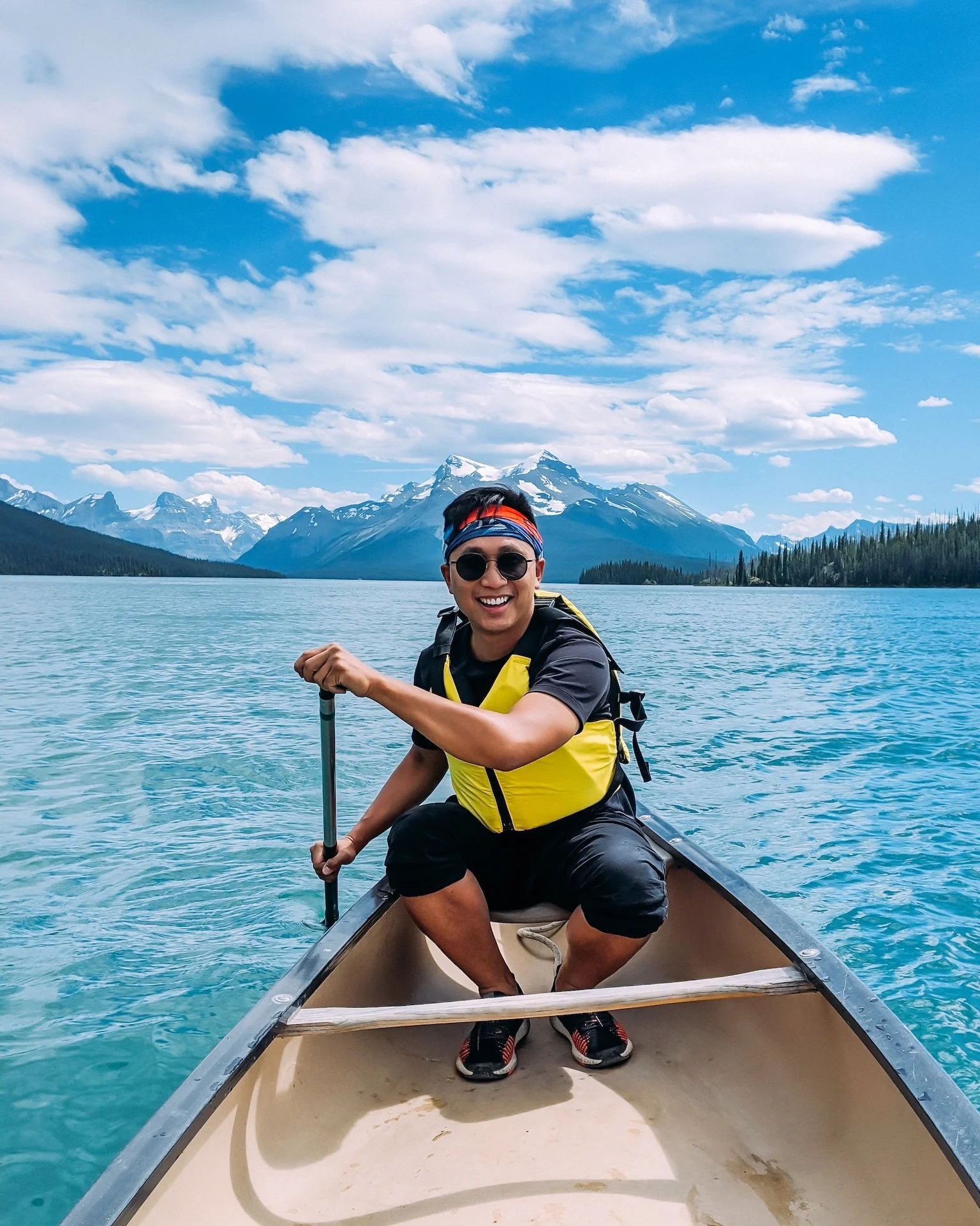 Gunnarolla paddles in a canoe on Moraine Lake, Alberta