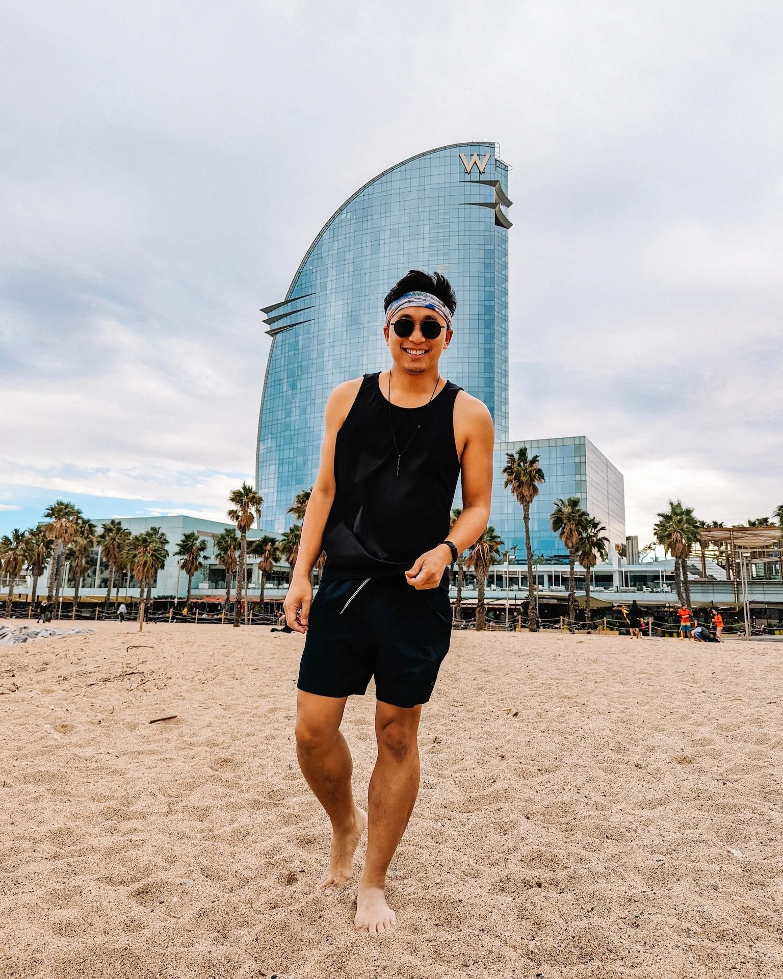 Gunnarolla stands on the beach in front of W Barcelona