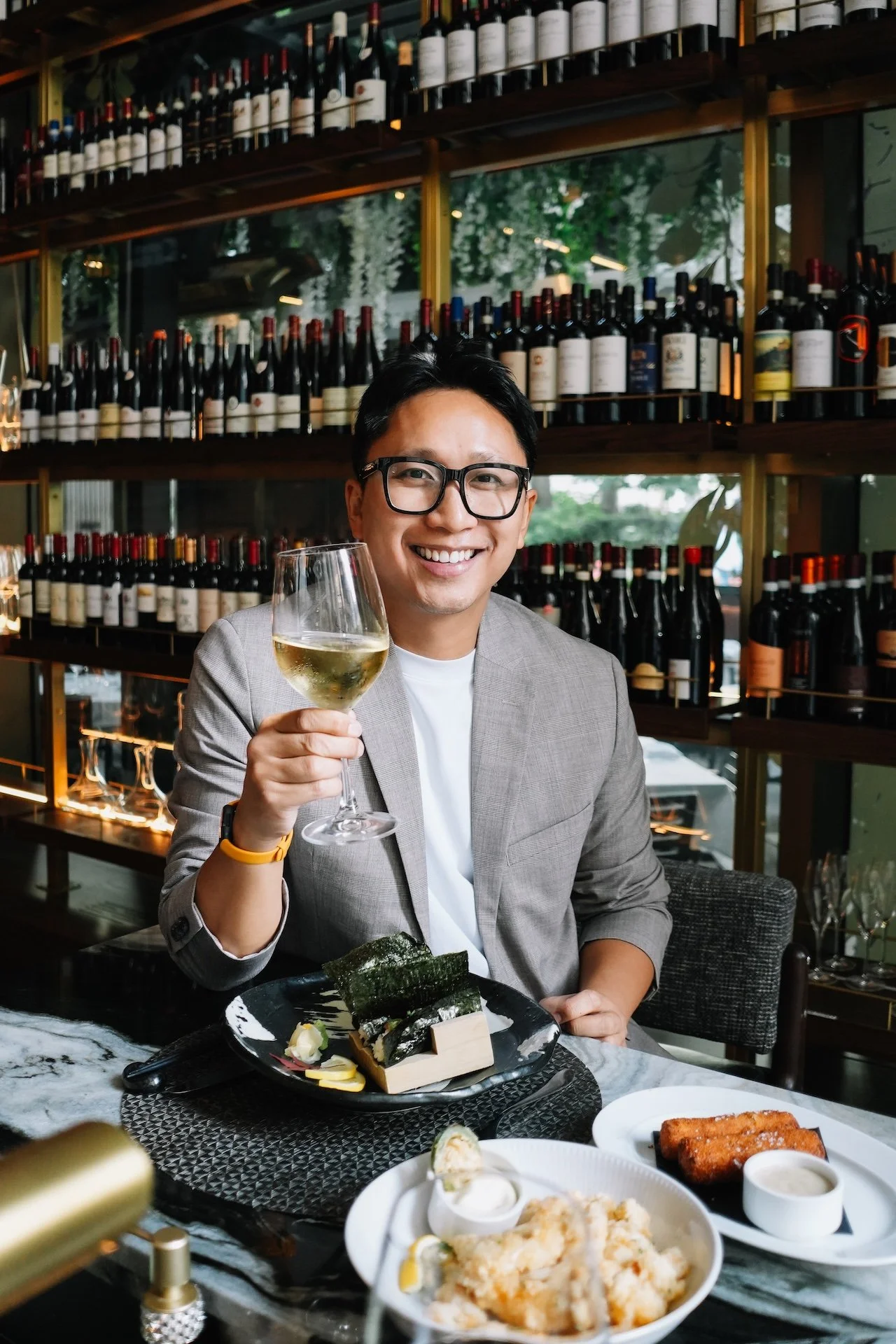 Gunnarolla holds a wine glass at Black & Blue, Toronto