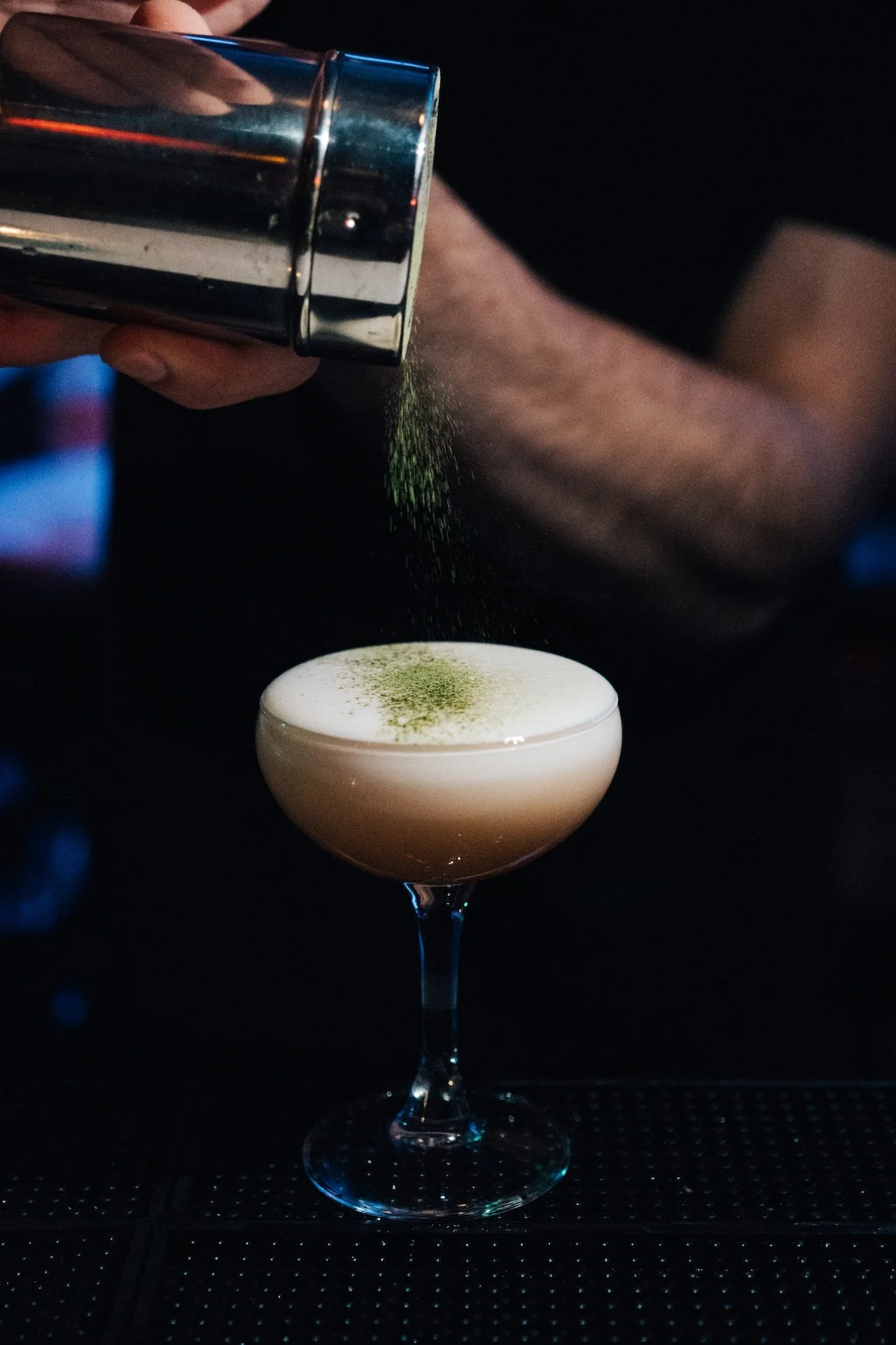 A cocktail with matcha powder at Dzo, Toronto