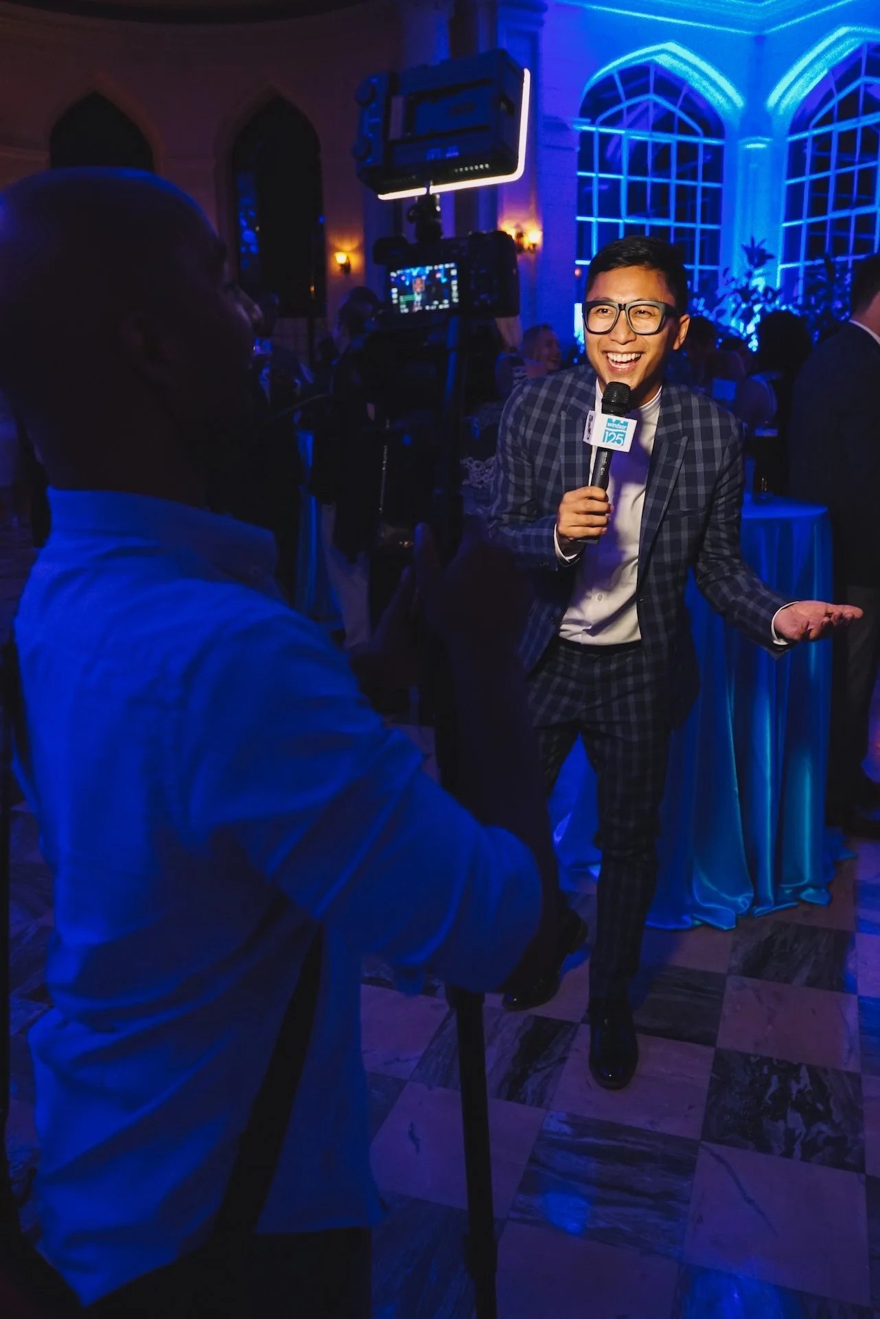 Behind the scenes of gunnarolla speaking to camera with a microphone in hand