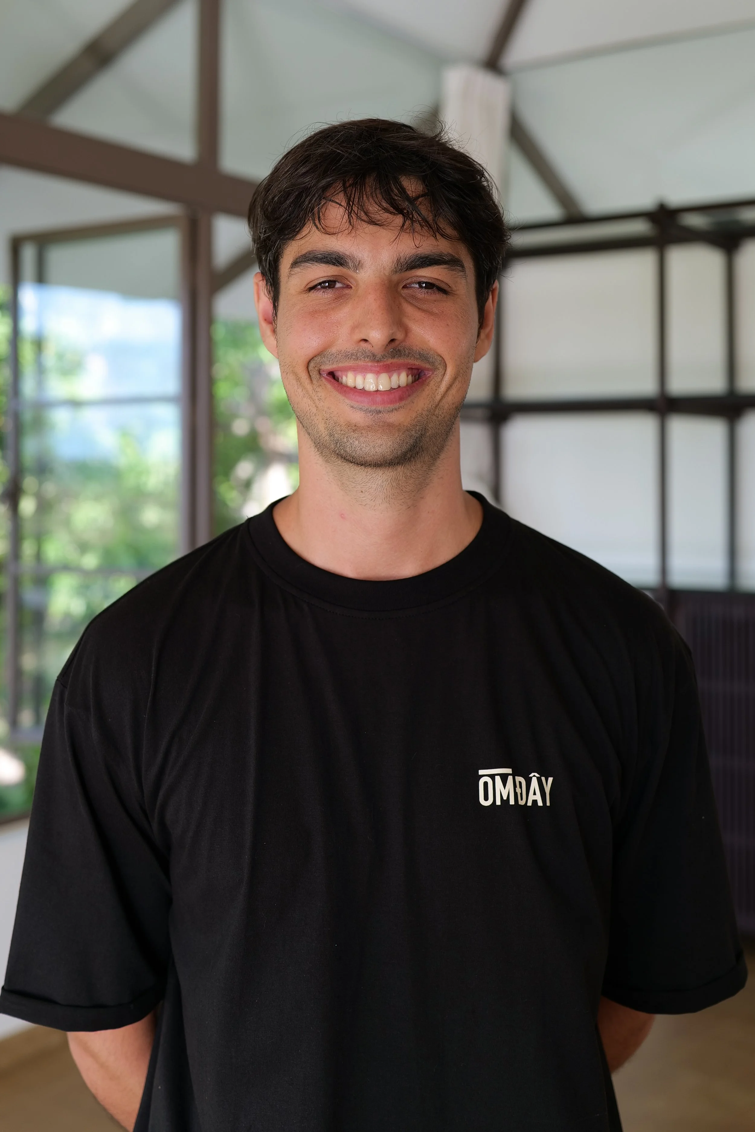 Harry JD, the creator and teacher of English for Vietnamese Yoga Teachers course standing at Om Day Yoga in Hoi An, Vietnam