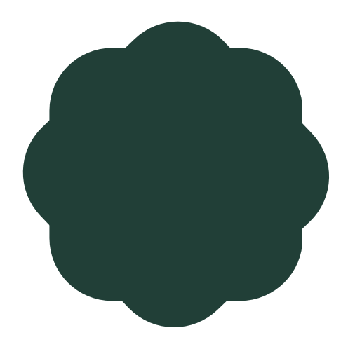A dark green four-leaf clover-shaped object with no additional context.