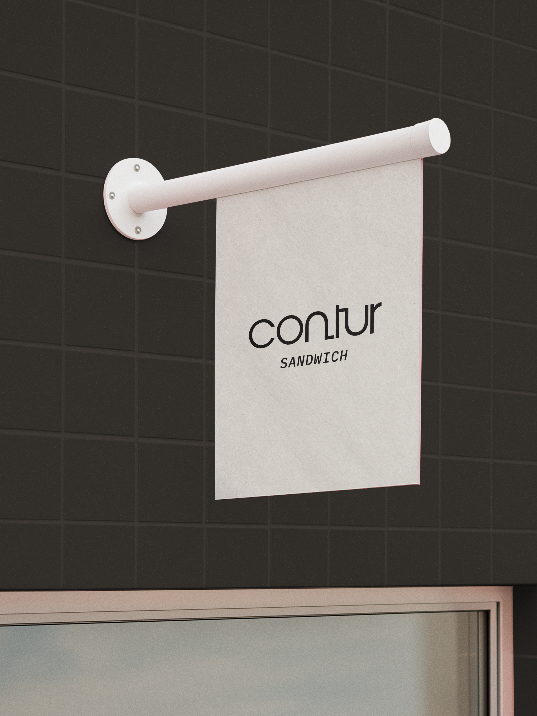 A white sign with black logo of "contur SANDWICH".