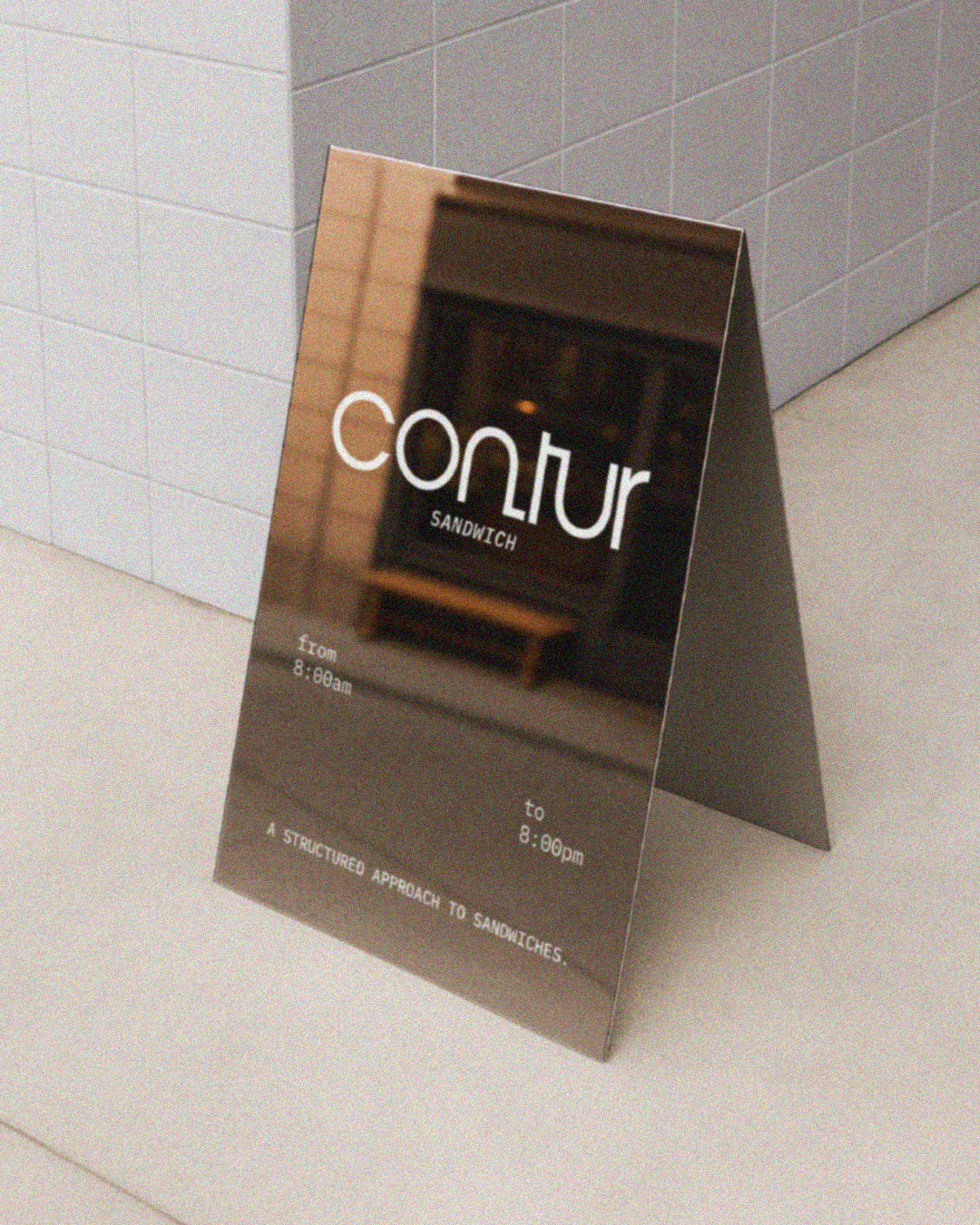 A sandwich shop signboard with the name 'Contur'