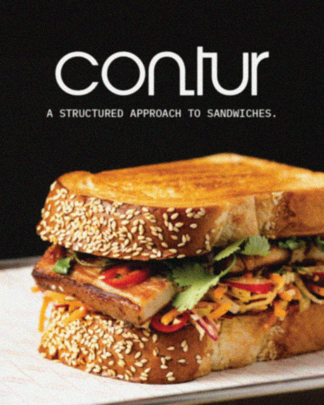 Close-up of a sandwich with the text 'CONTUR, A structured approach to sandwiches'.