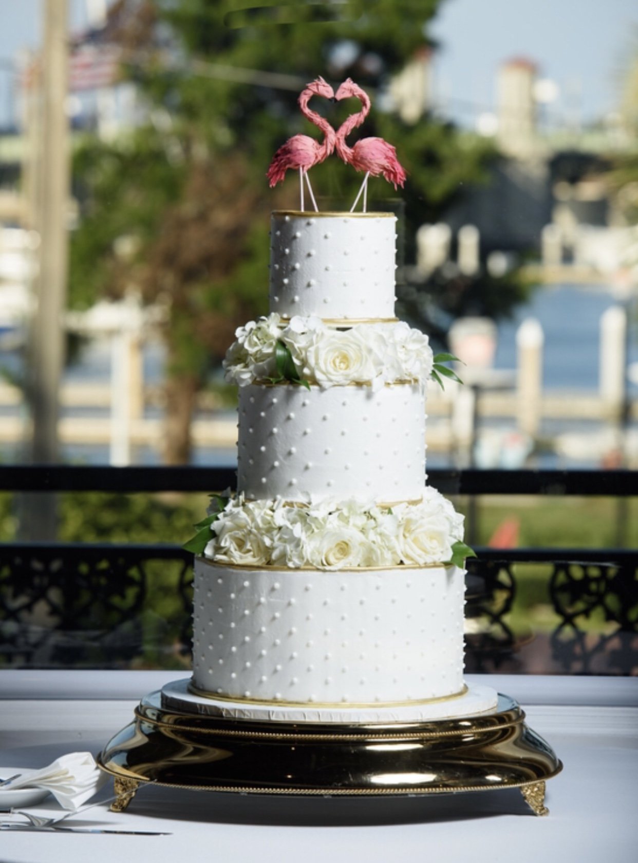white cake with pearls and flamingos.JPEG