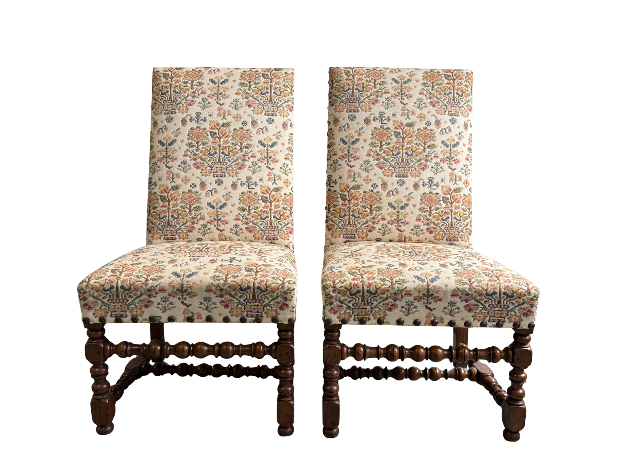 A Pair of Louis XIII Walnut and Upholstered Chairs