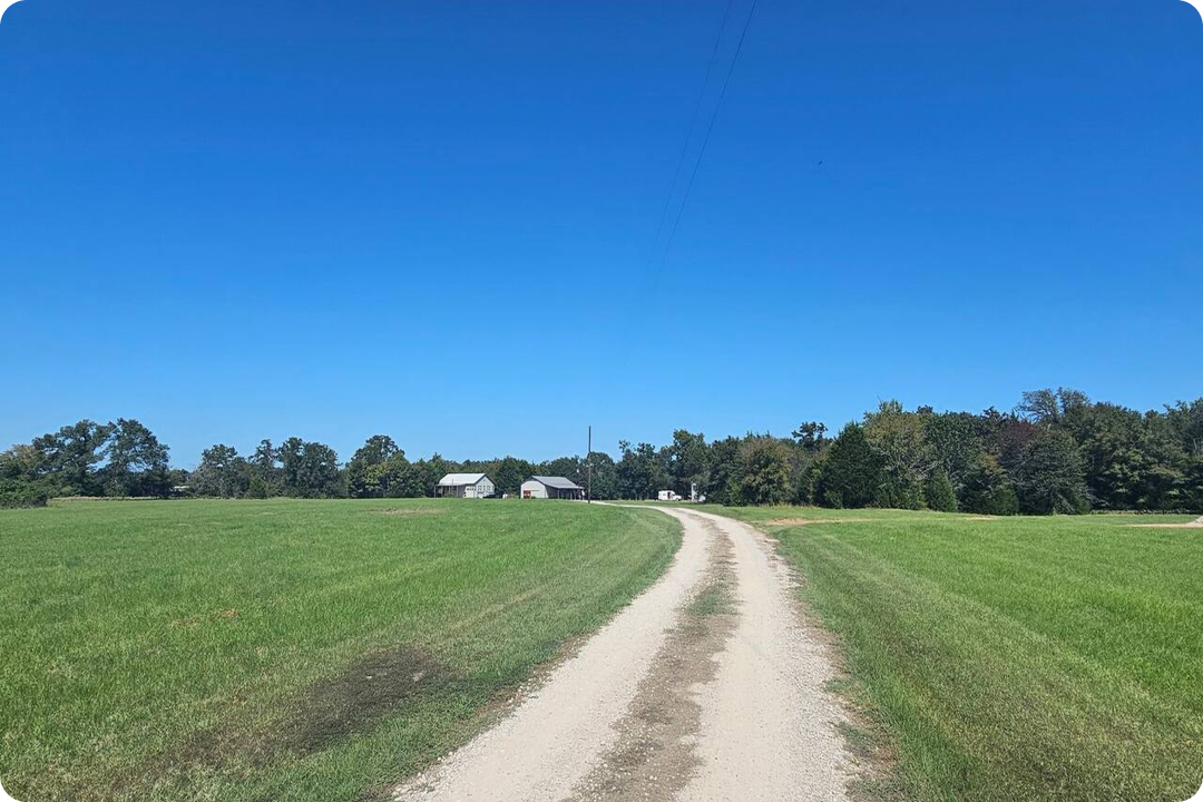 Winding gravel nature trail for hiking and biking through green pastures in Canton TX.