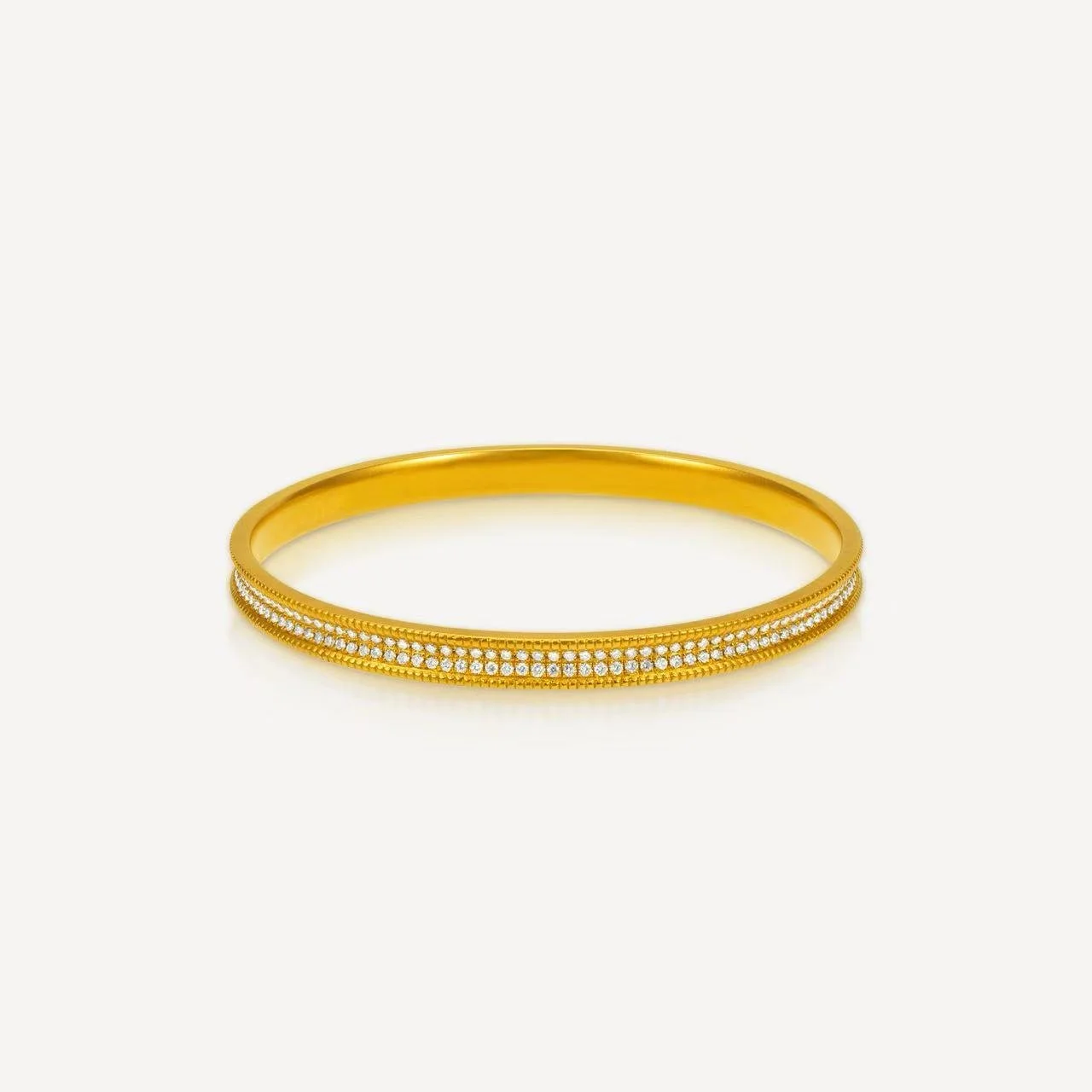 Gold bracelet with two rows of small diamonds on a white background.