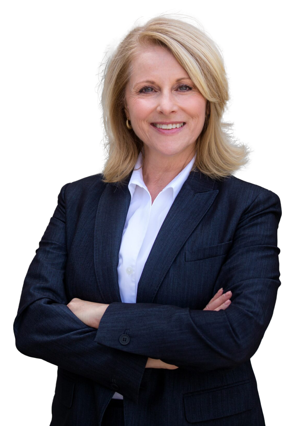 A confident middle-aged woman with blond hair wearing a black blazer and white shirt, smiling with arms crossed.