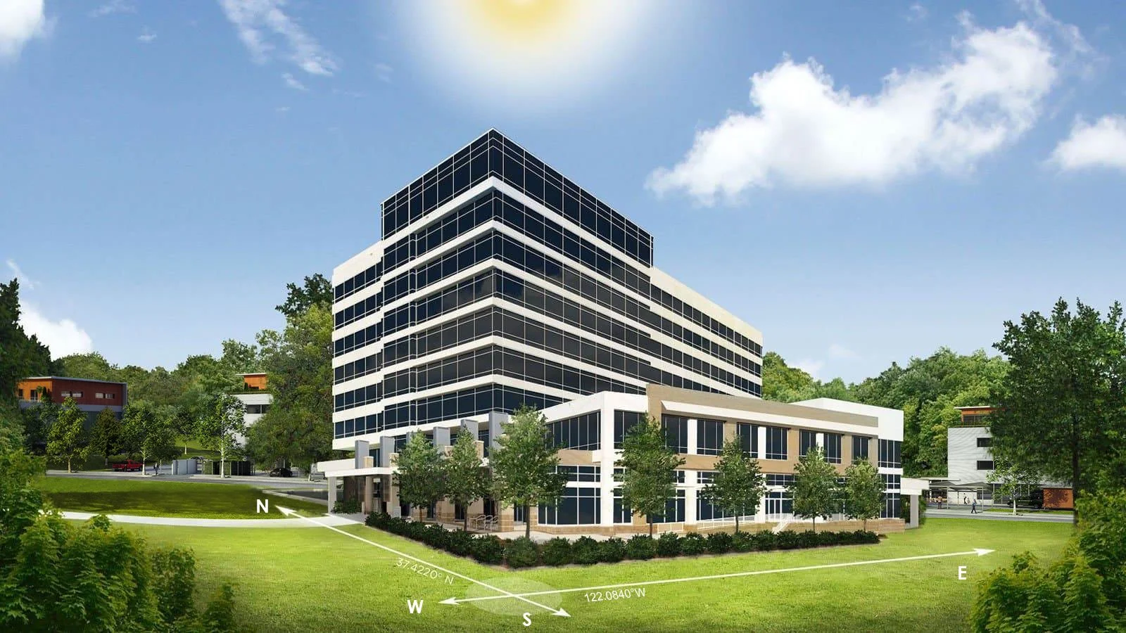 A modern multi-story office building with glass windows, surrounded by green trees and grass, under a bright blue sky with a few clouds and the sun.