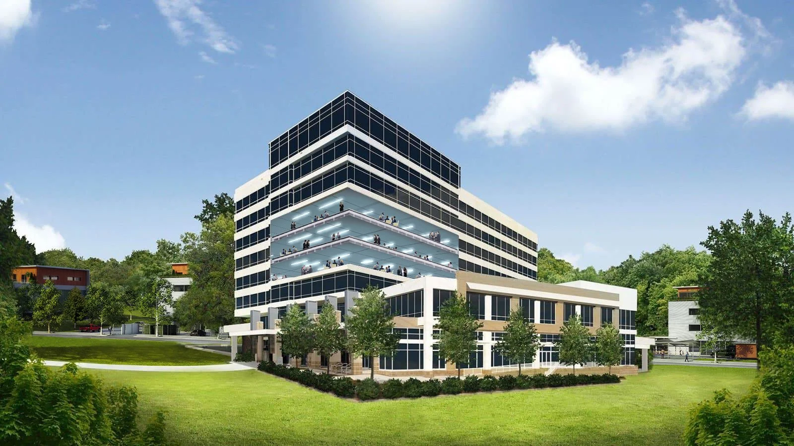 A modern, multi-story office building with glass windows and balconies, surrounded by green trees and a well-manicured lawn, under a blue sky with a few clouds.