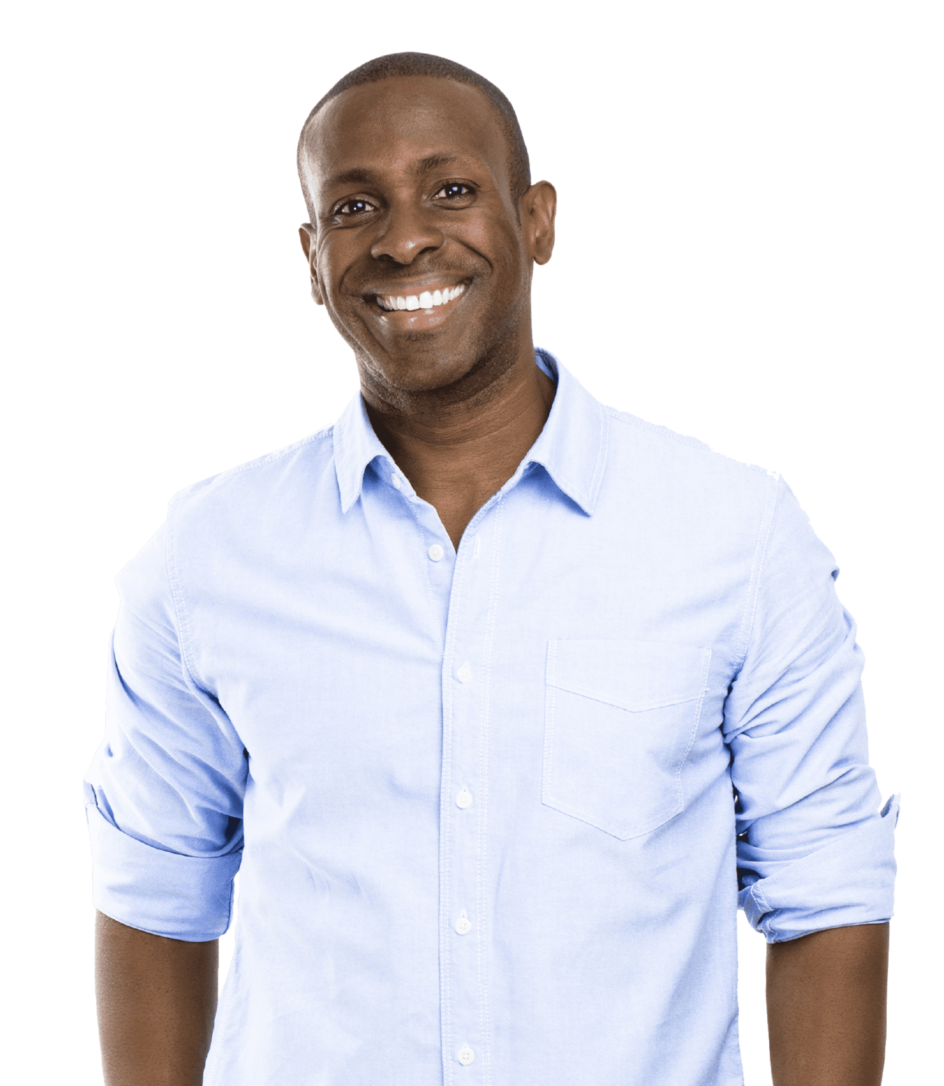 Smiling Black man wearing a light blue button-up shirt with rolled-up sleeves, standing against a plain background.