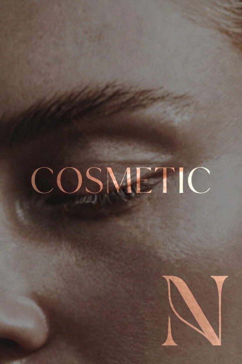 Close-up of a person's eye with makeup, and the word 'COSMETIC' across the eye, with a large 'N' below.
