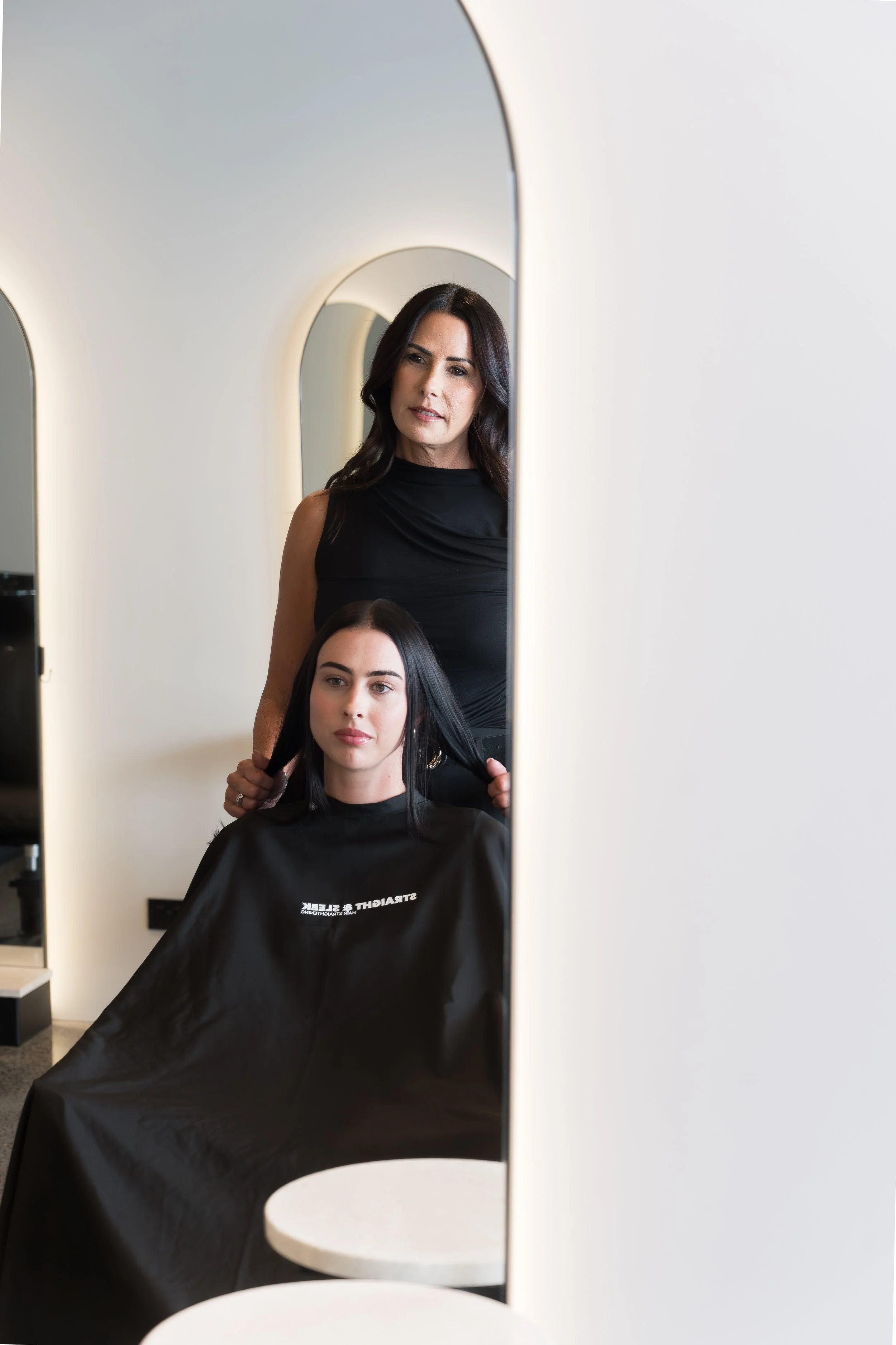 Hair straightening consultation at Straight & Sleek salon with founder and client in the Kirra studio.