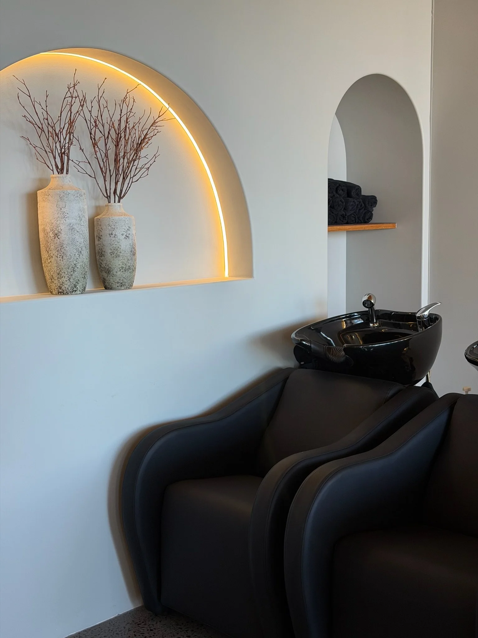 Relaxing hair wash basin with reclining massage chair at Straight & Sleek hair straightening salon