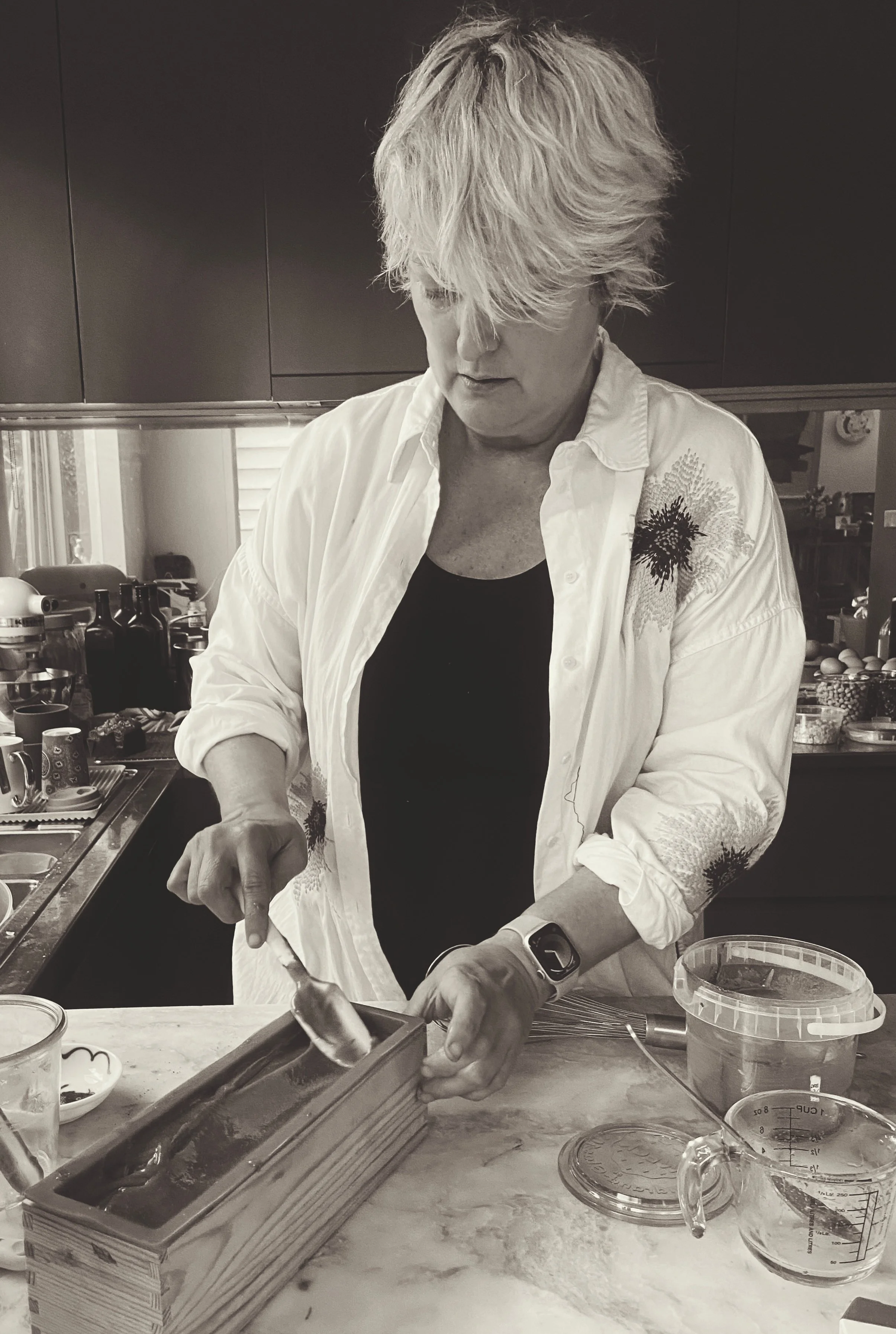 Fashionable middle aged woman hand making luxurious bespoke products from her home kitchen.  Chef's kitchen, hospitality entrepreneur from Melbourne turning her creative skills to making amazing products for everyday use.