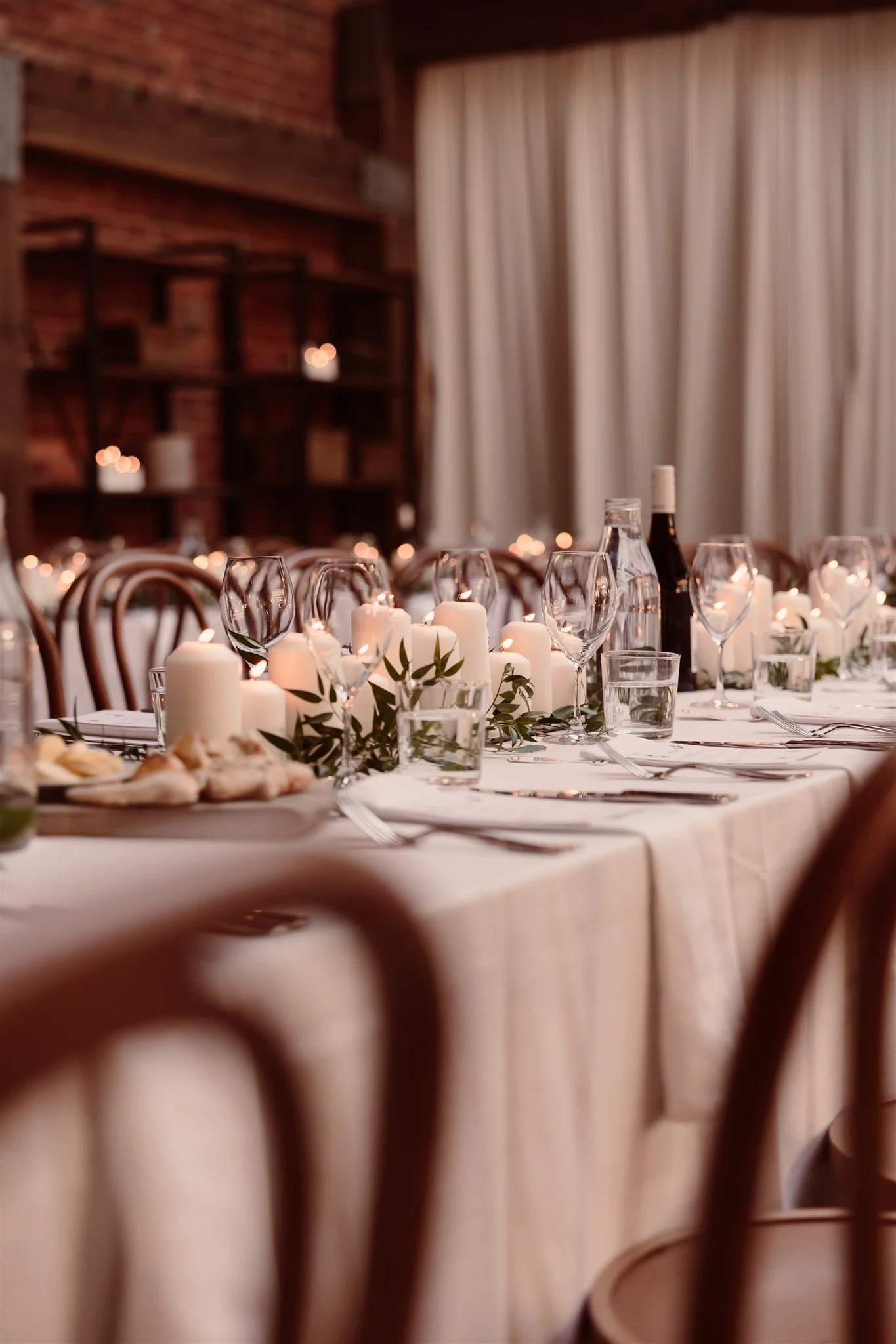 A warmly lit wedding reception. Wedding styling by Alex Morabito.