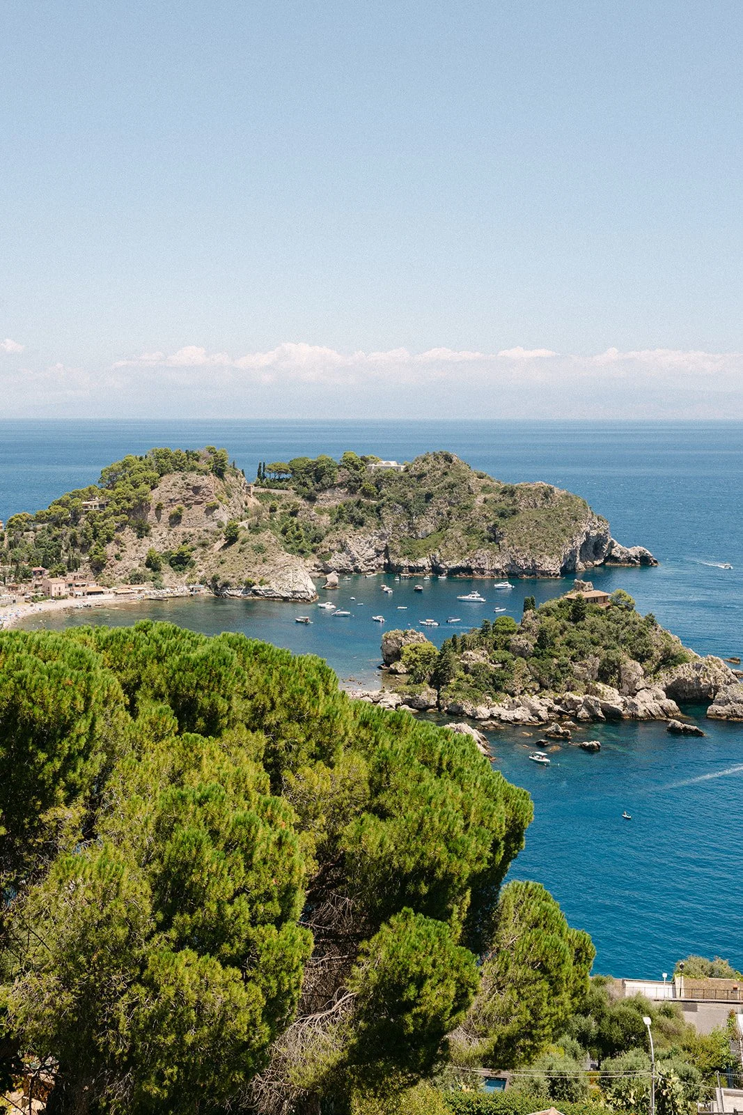 Scenic view of Isola Bella in Taormina, a destination wedding venue called Villa Mon Repos where Alex Morabito plans and coordinates weddings in Italy.