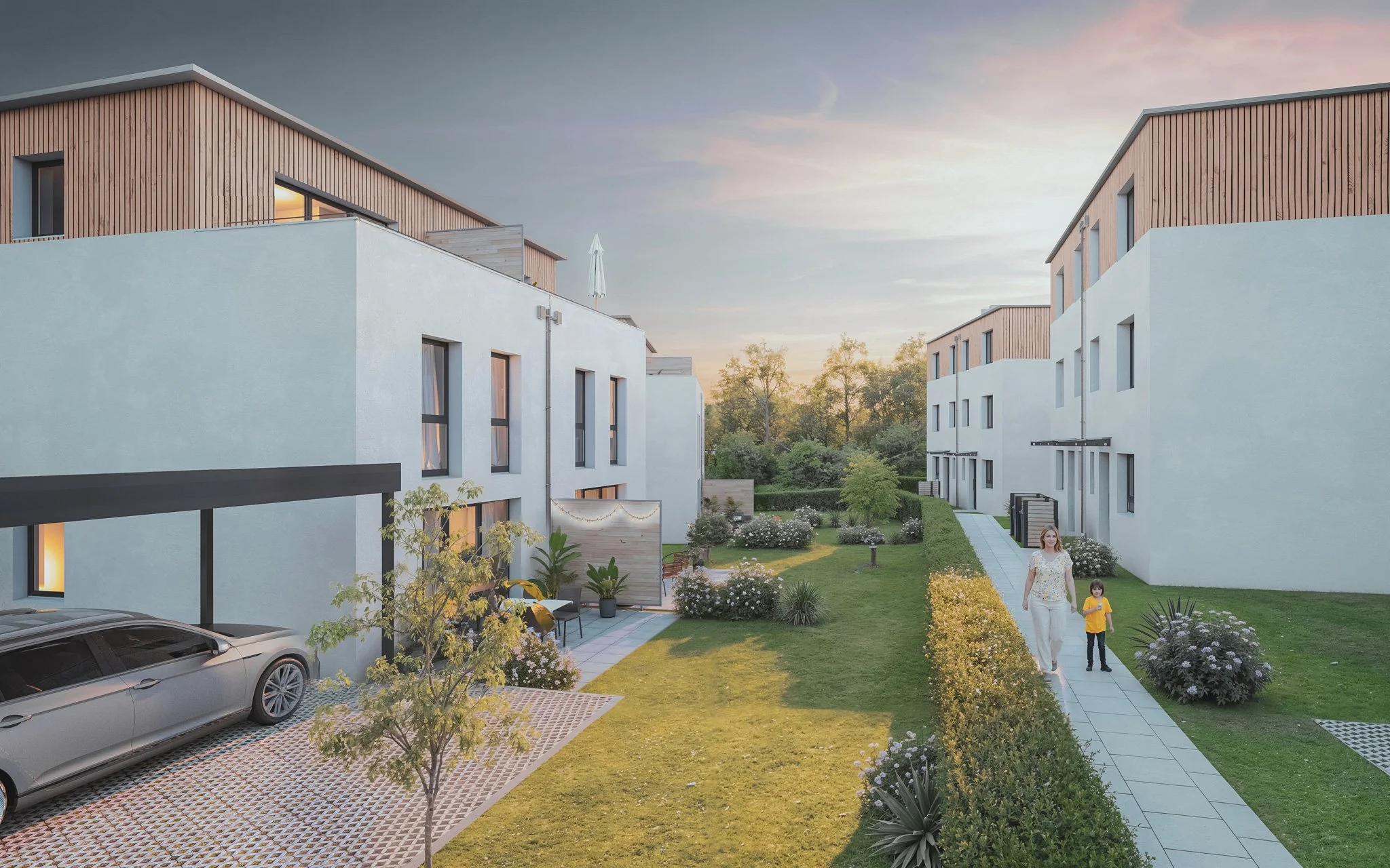 Moderner Wohnkomplex mit weißen Gebäuden, Garten und Parkplatz bei Sonnenuntergang, Frau mit Kind spazieren auf Wegen.