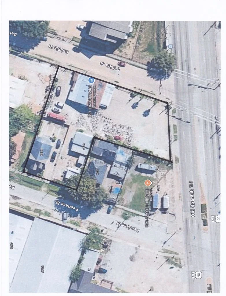 Aerial view of a property with outlined boundaries, showing parking spaces, buildings, and neighboring streets labeled 'Del Rio St.', 'Peregrino St.', and 'Old Spanish Trl'.