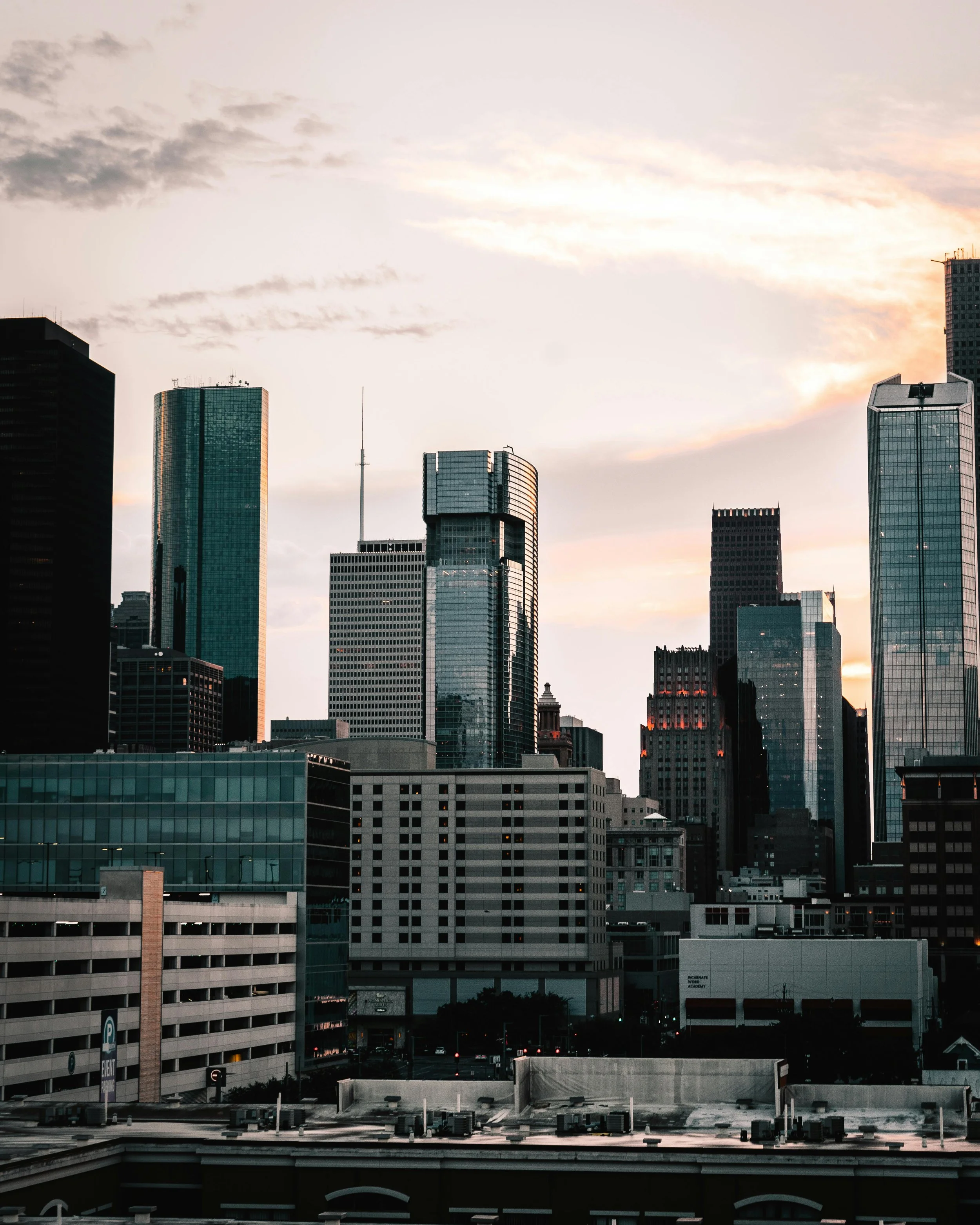 Skyline of Houston,Tx with tall modern skyscrapers during sunset.