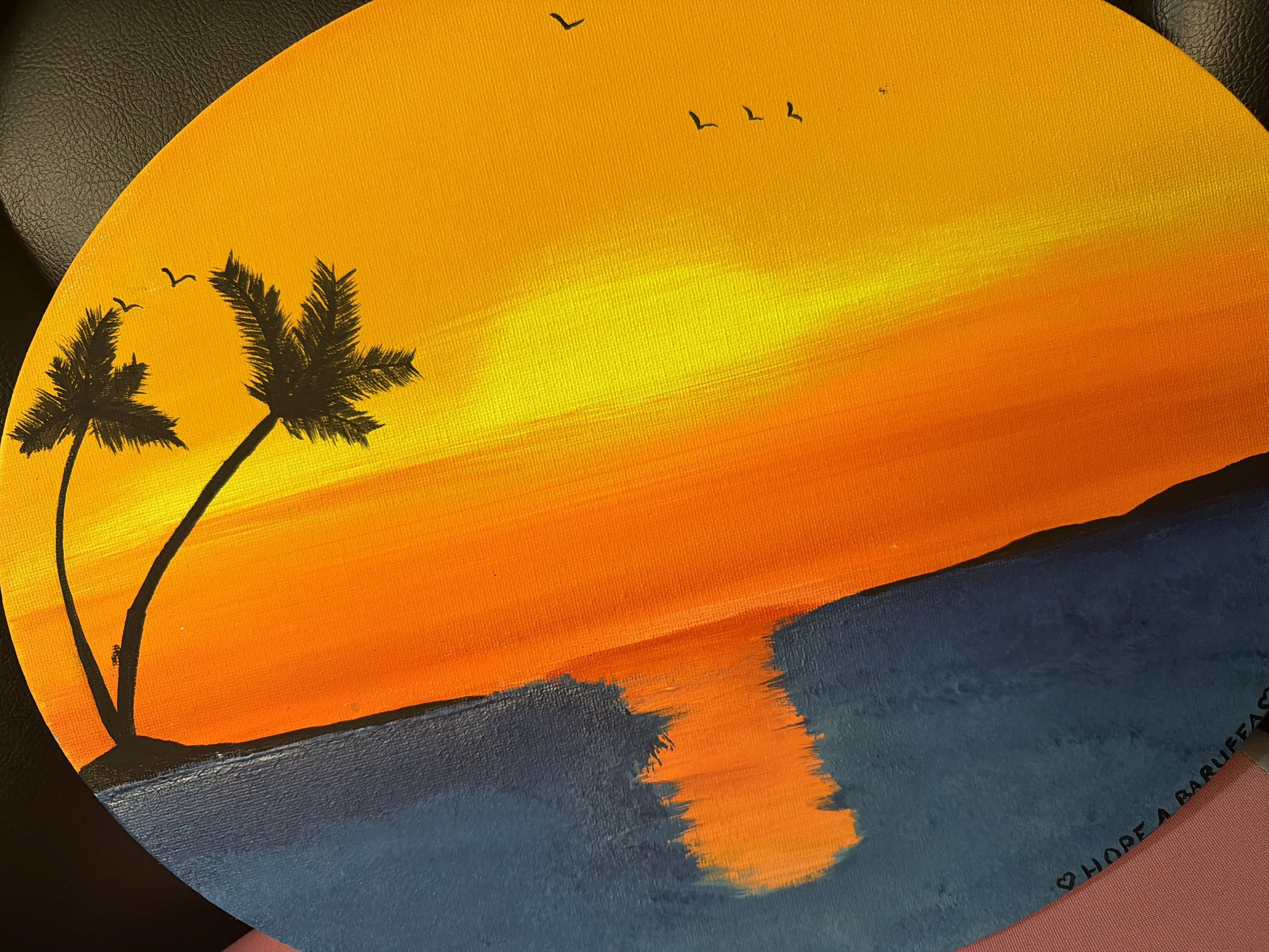 Poster of a sunset with silhouettes of two palm trees and flying birds