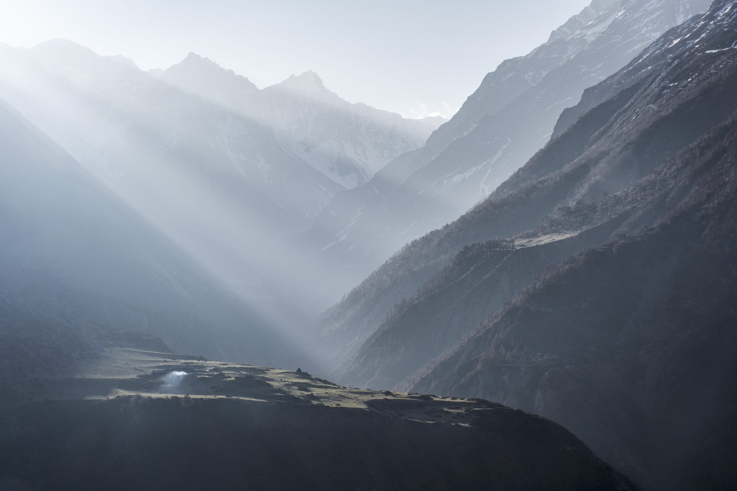 Morning light falls across the opposite hills as seen from Mu Gompa. Smoke rises from a lone yak herder’s hut. Mu Gompa, perched at nearly 4,000 meters on a windswept ridge, remains a true hermitage: stark, isolated, and deeply spiritual. Tsum Valley
