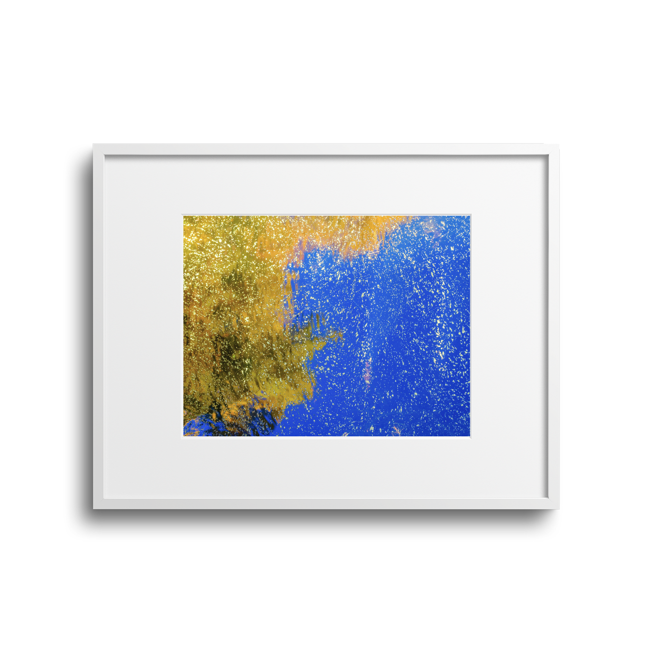 Abstract artwork with blue, gold, and black splatter patterns in a white frame.