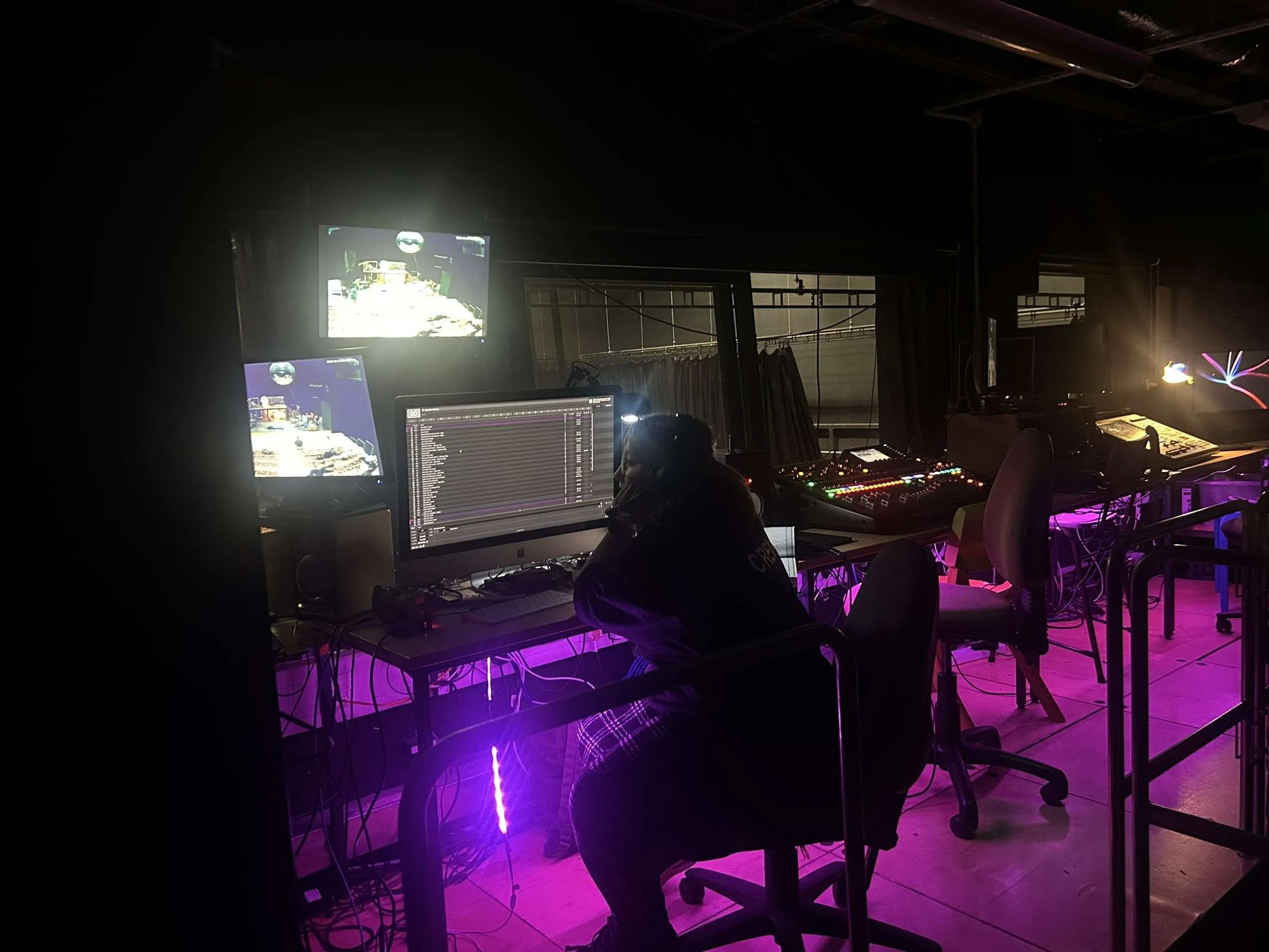 This is a picture that was taken of me whilst I was testing a QLab file, which is another software that I have a lot of experience with.