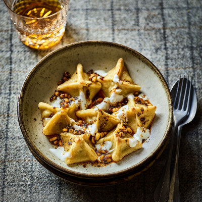 Baked Haggis Manti with Garlic Yogurt, Melted Butter, Pine Nuts, Pul Biber &amp; Mint