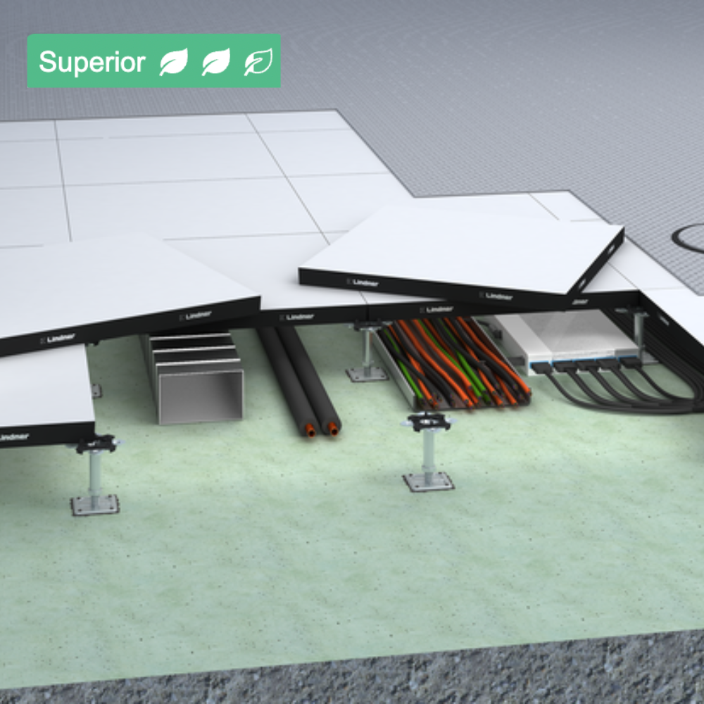 Close-up view of a solar panel installation showing the underside with electrical wiring and cables connected to the panel. The background consists of a concrete and tile surface.