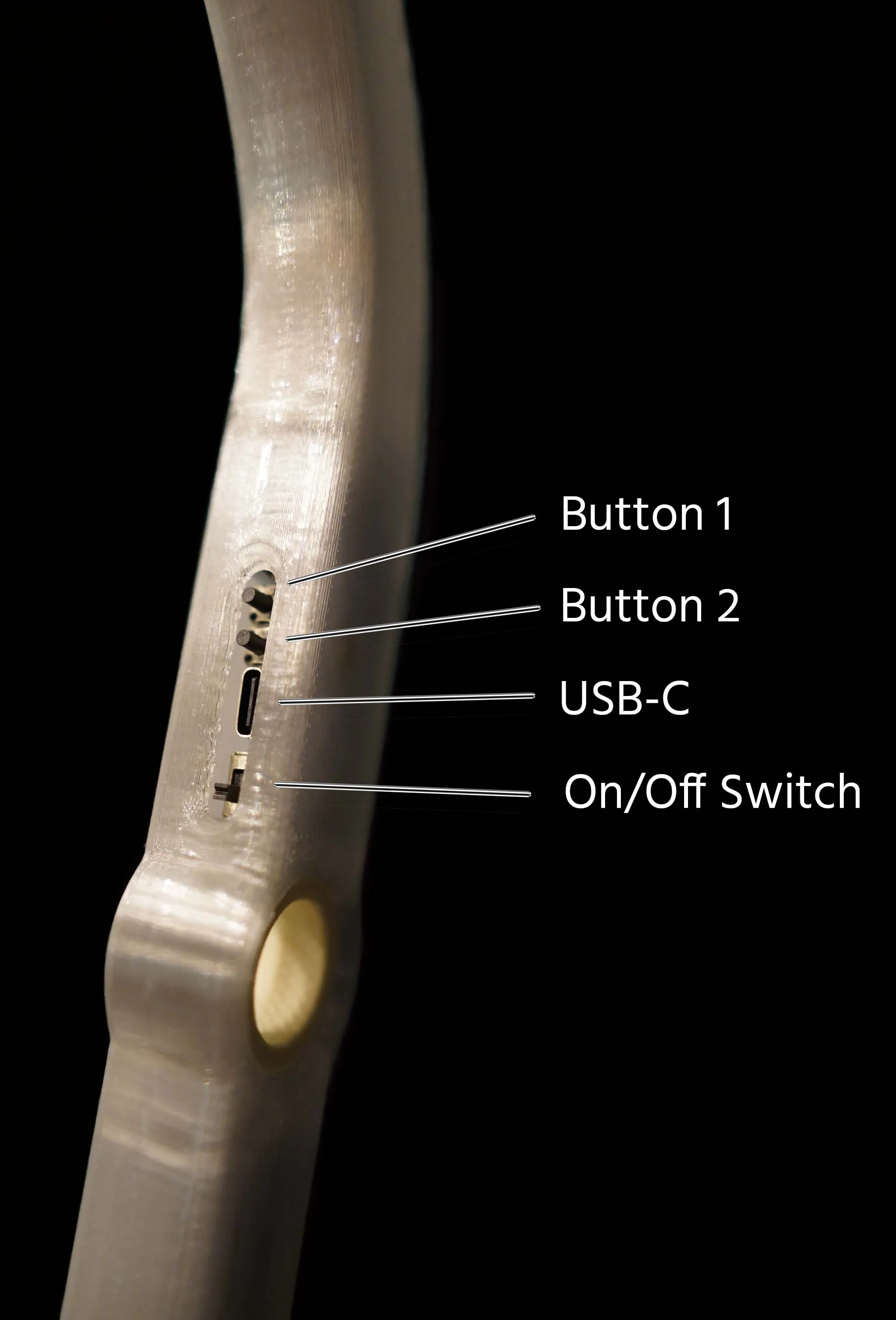 Close-up of a metal guitar neck showing labeled components: Button 1, Button 2, USB-C port, and On/Off switch.