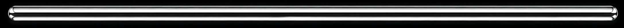 Close-up of two pen caps with a black background.