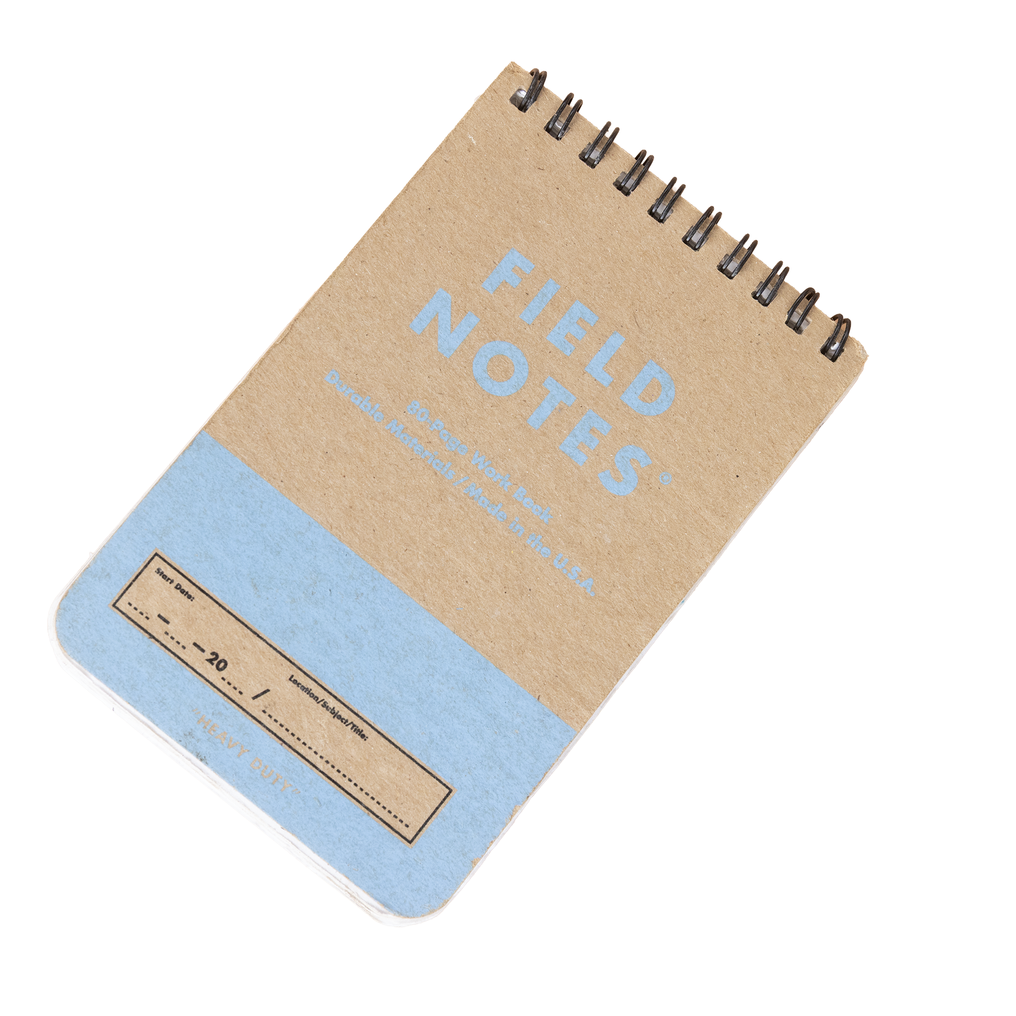 Close-up image of a spiral-bound notebook with a cardboard cover titled 'FIELDS NOTES' in light blue text, showing part of the cover and spiral binding on the top edge.